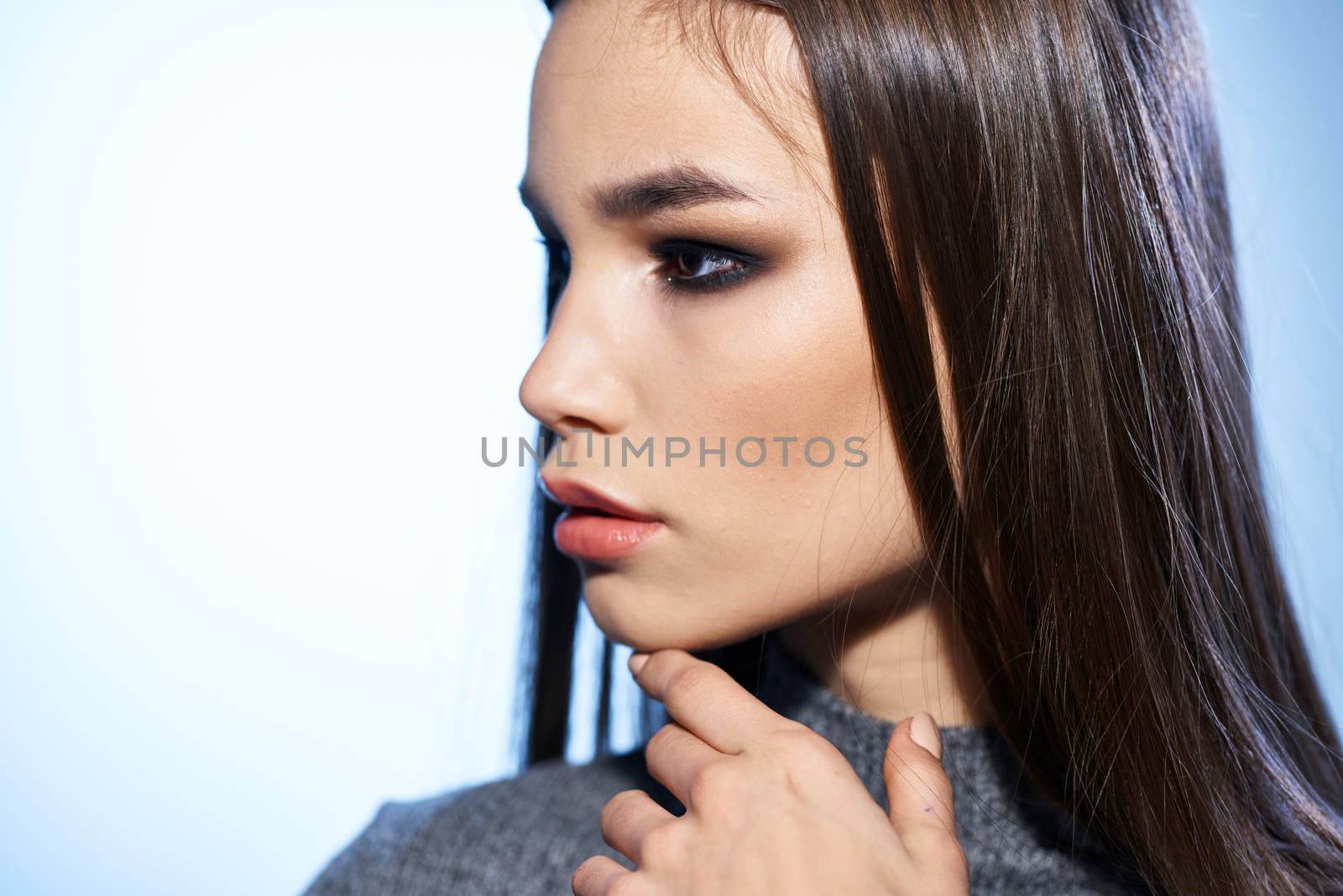 Beautiful woman cosmetics long hair cropped studio model. High quality photo