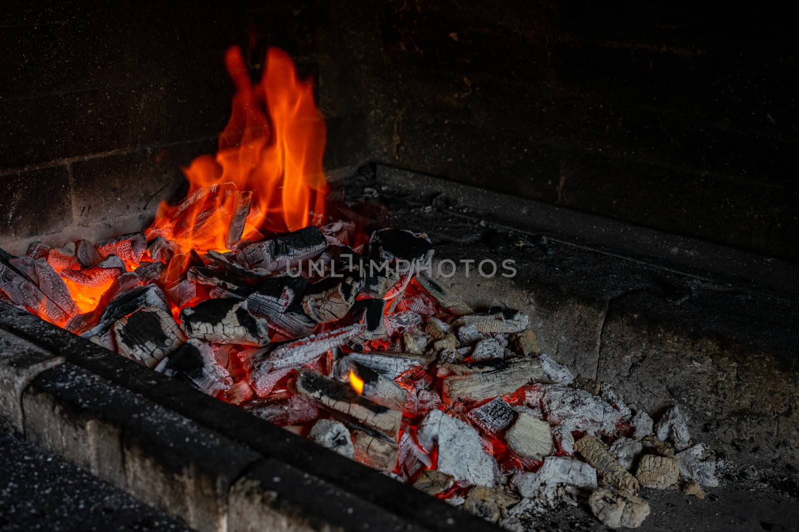 Barbecue. The fire is burning in the grill. by Serhii_Voroshchuk