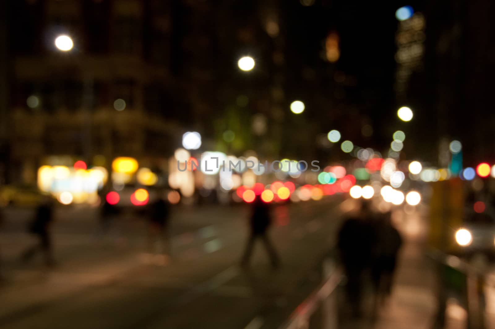 Defocused abstract background of people walking at night in busy by eyeofpaul
