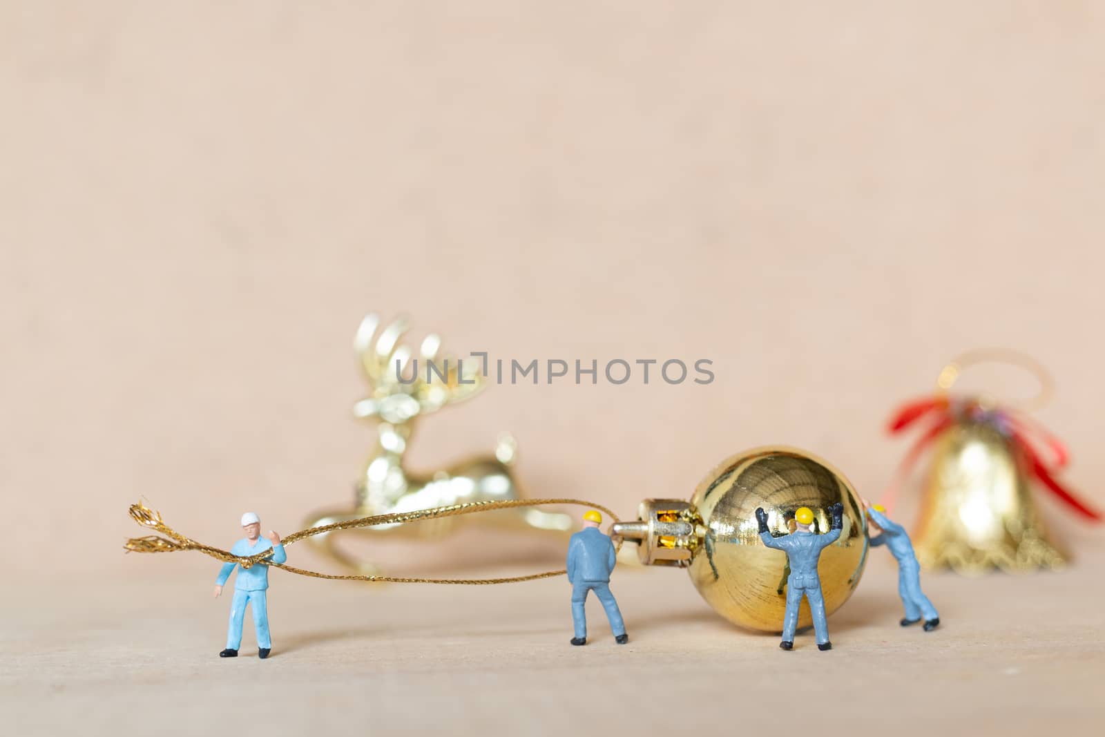 Miniature people,  Worker team working with a Christmas decorati by sirichaiyaymicro
