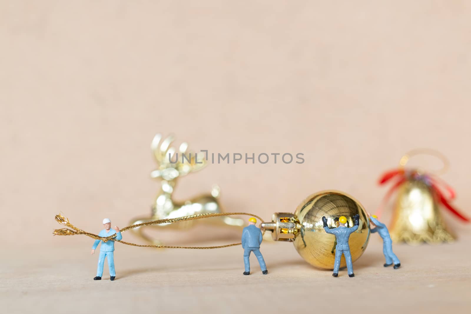 Miniature people,  Worker team working with a Christmas decoration , Christmas and Happy New Year concept.