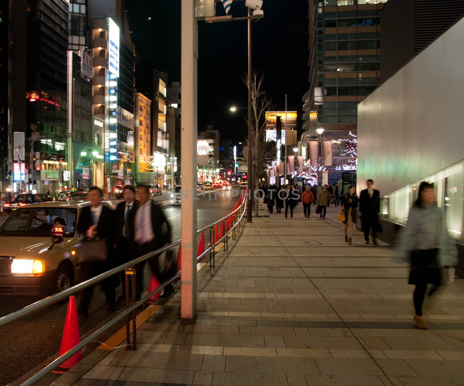 Bustling busy night scene in Tokyo Japan