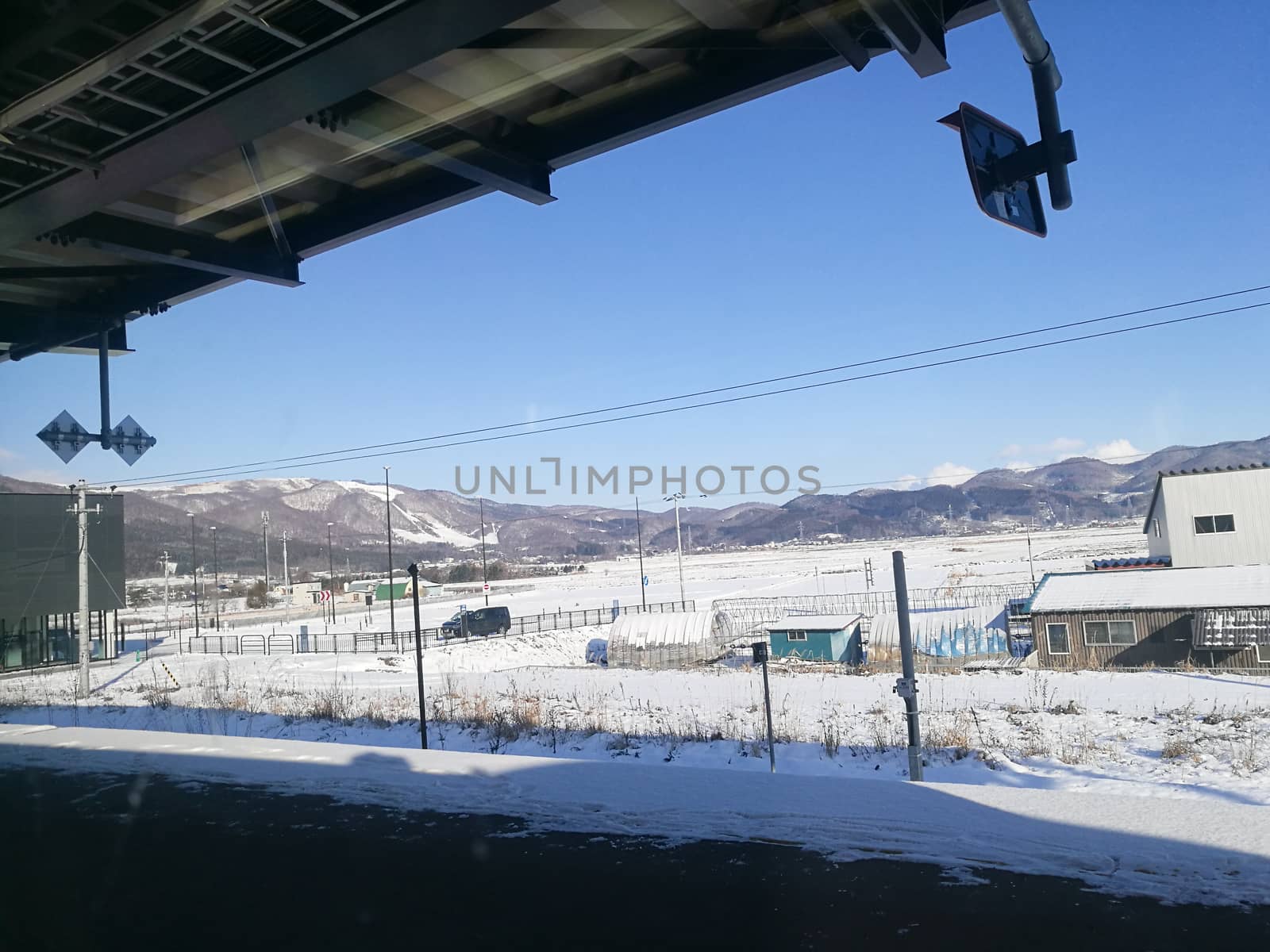 Far away train station in sunny day of Winter in Hokkaido Japan by eyeofpaul