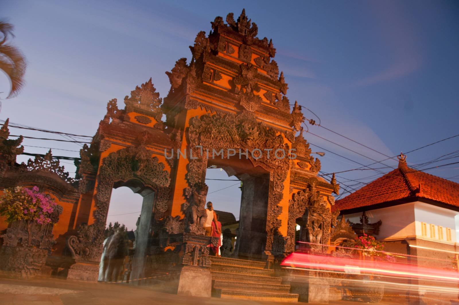 Traditional entrance gate of Tanah Lot beach in Bali with light movement