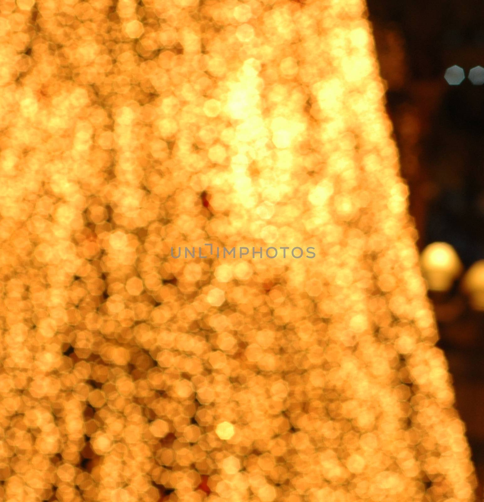 Defocused golden yellow Christmas New Year celebration festive l by eyeofpaul