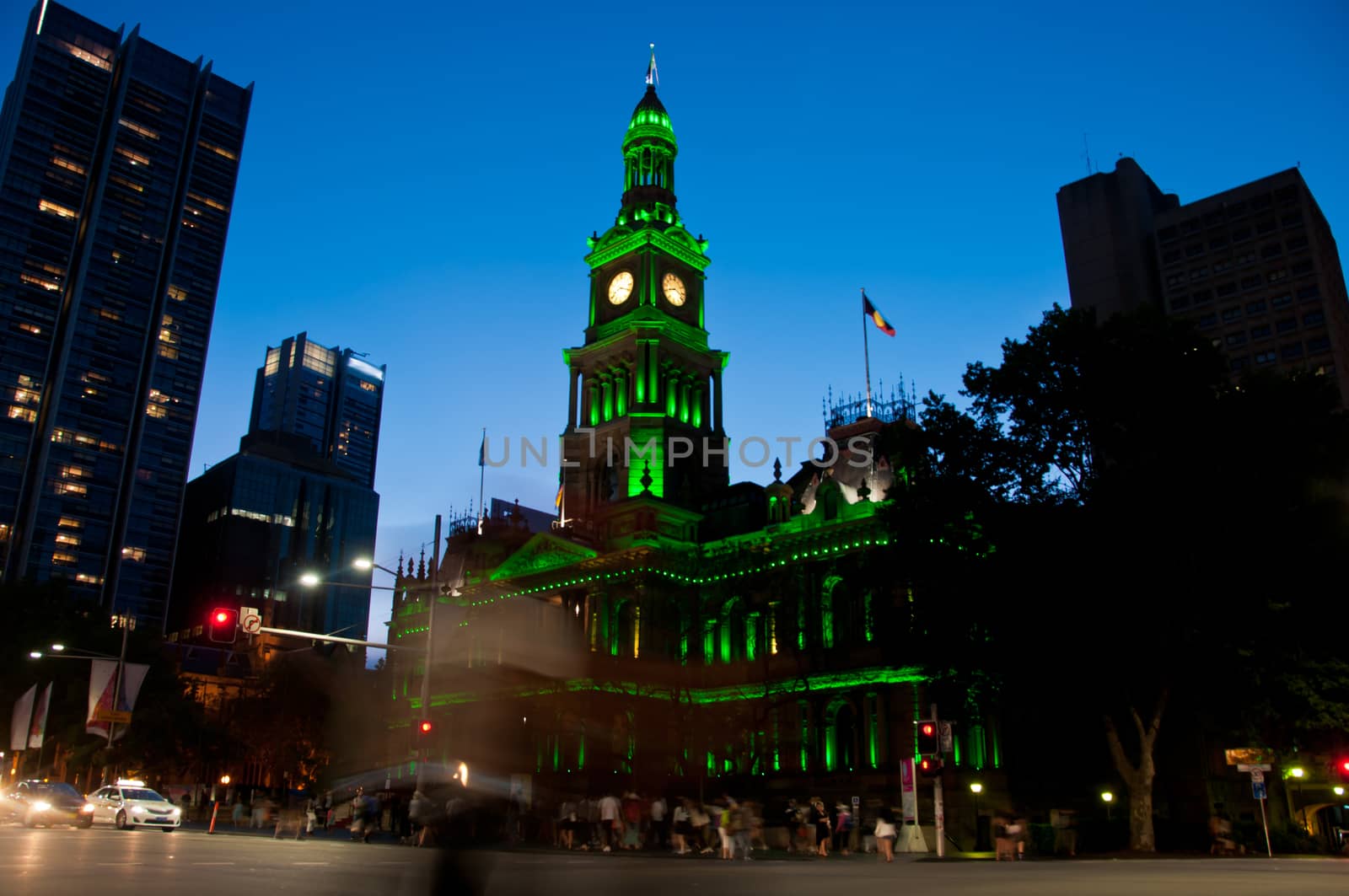 Light moving of bustling city center scene with old clock tower in Sydney