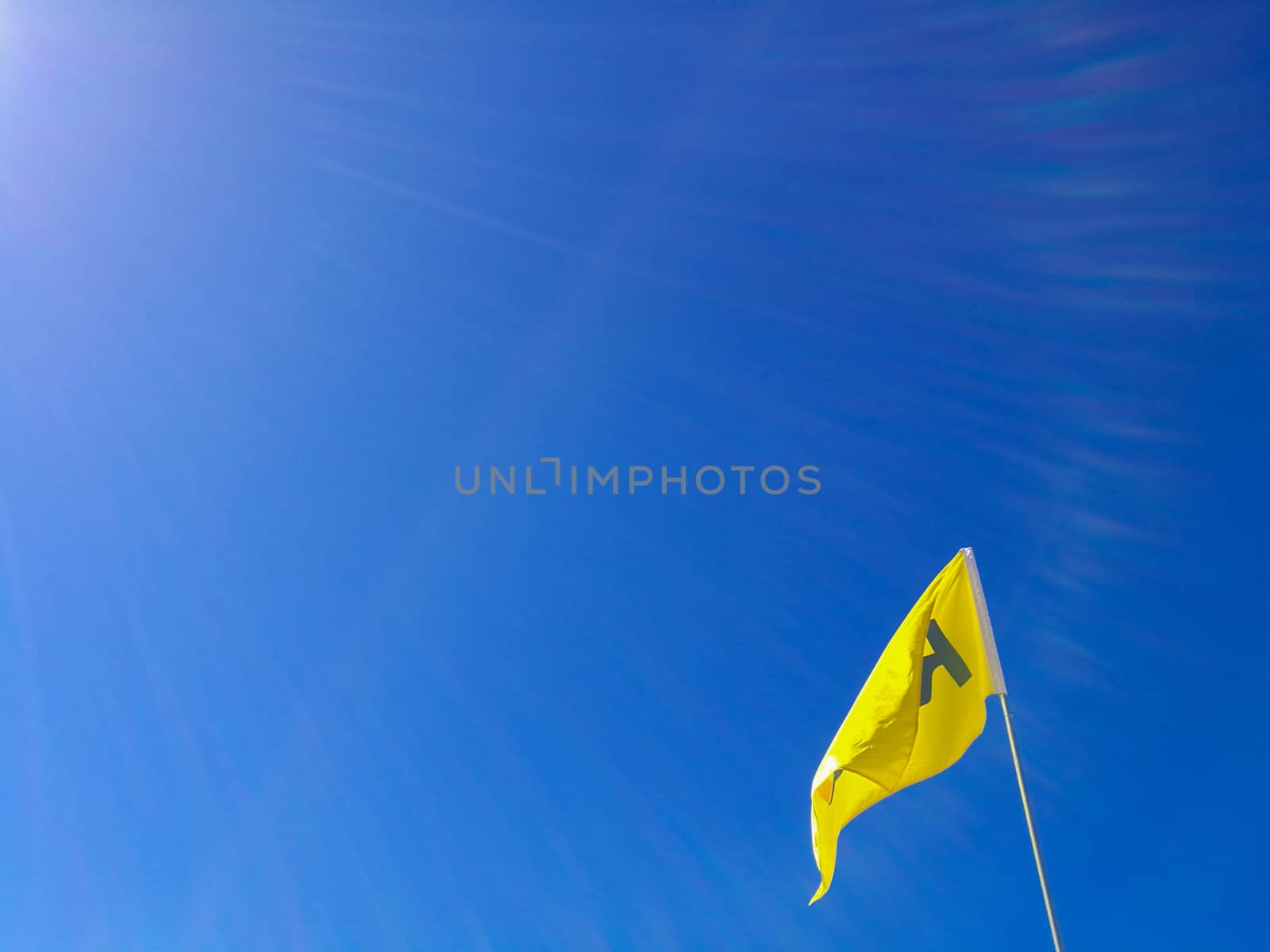 Flying flag of letter A with blue bright sky by eyeofpaul