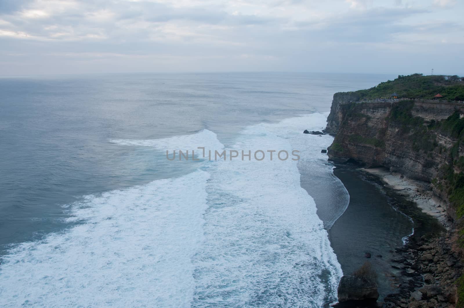High big clift with stunning beach in Bali by eyeofpaul