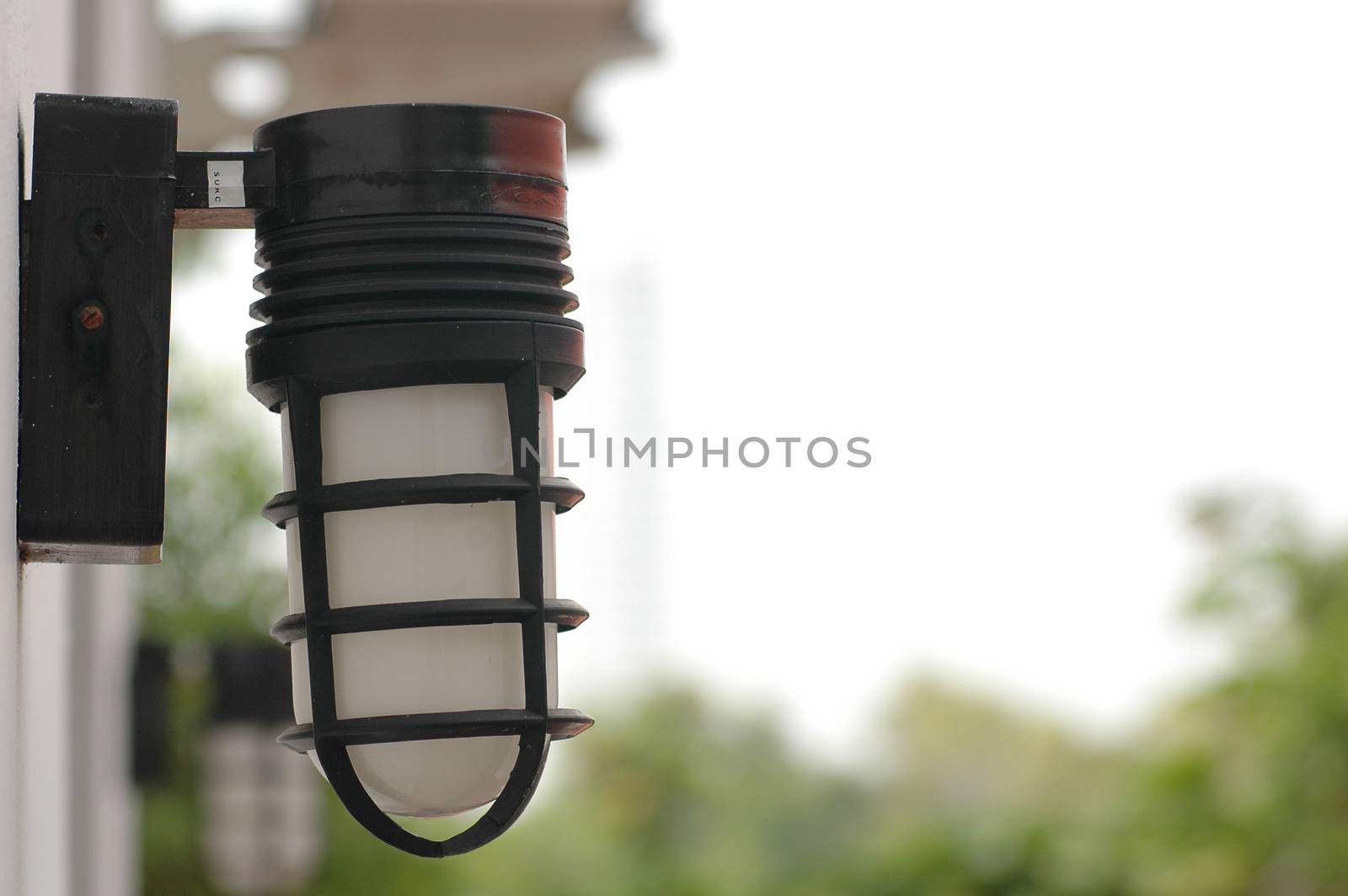 Decorative garden house lamp lantern in daylight by eyeofpaul