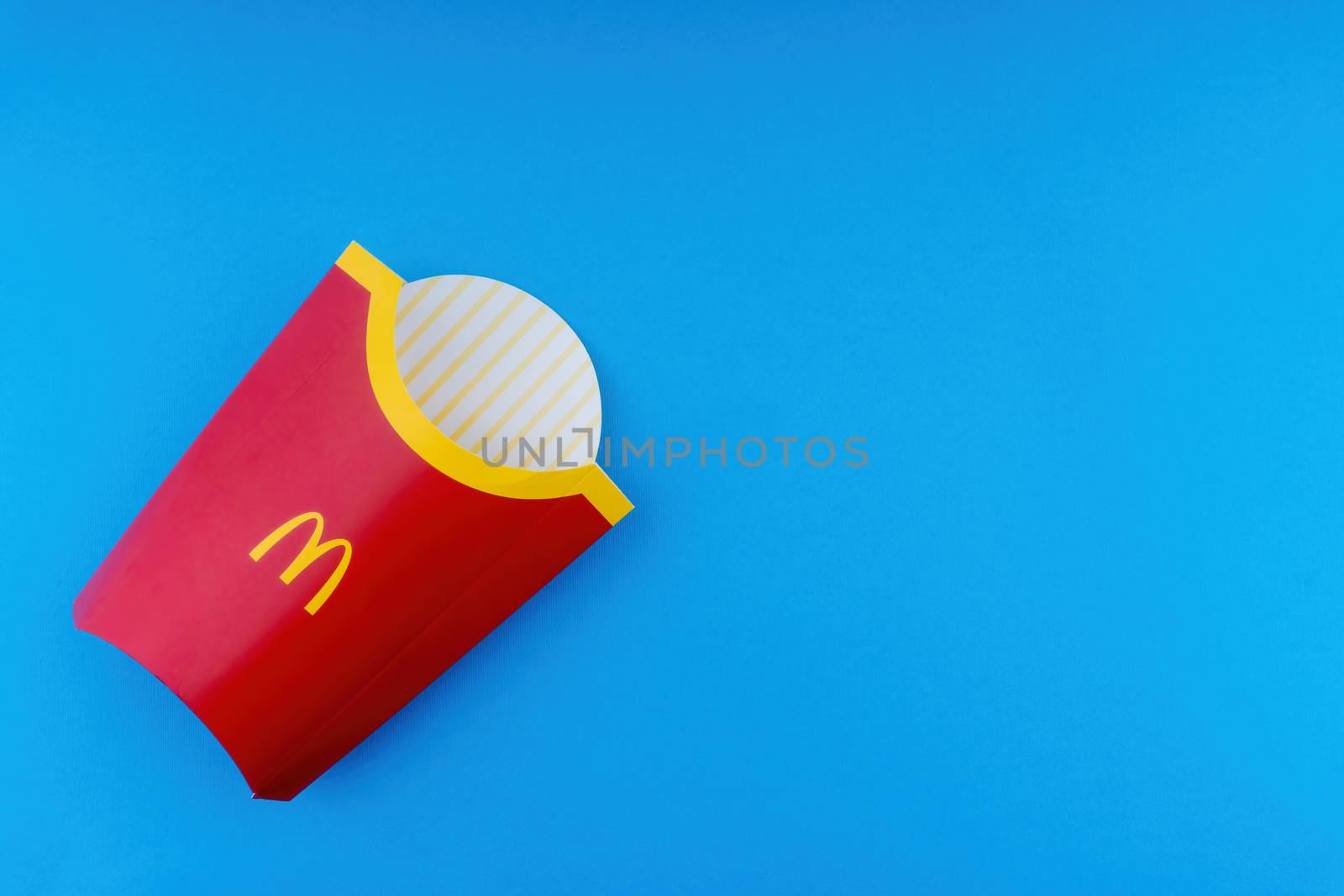 Kuala Lumpur, Malaysia - October 19, 2020 : McDonalds French fries  box on blue background by silverwings