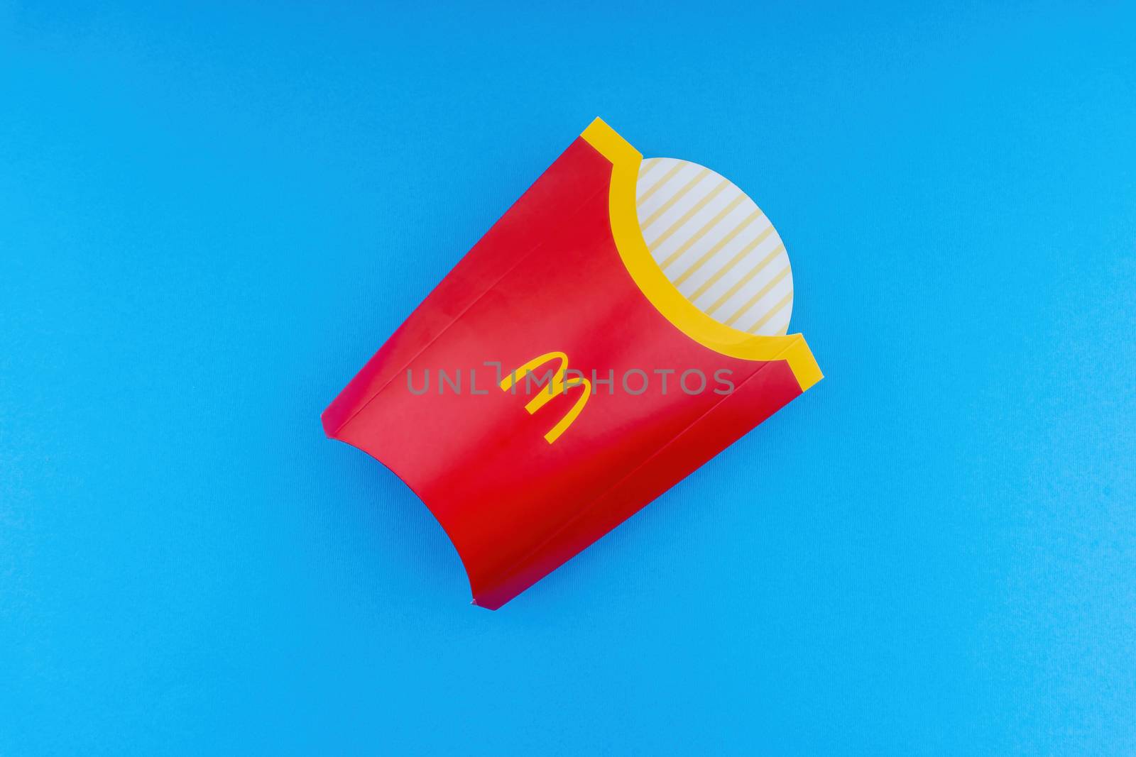 Kuala Lumpur, Malaysia - October 19, 2020 : McDonalds French fries  box on blue background
