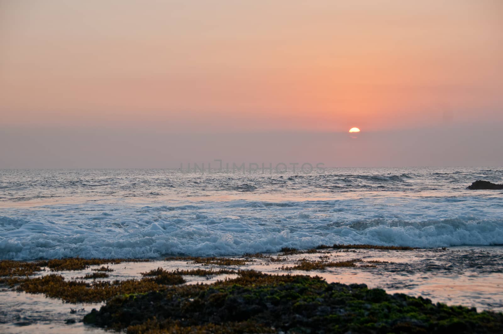 Wave and Sunset scene at Tanah Lot beach in Bali Indonesia by eyeofpaul