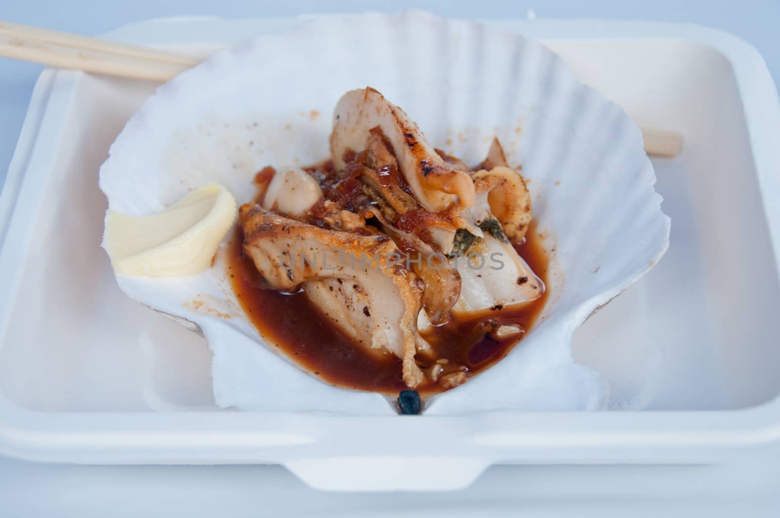 Grilled giant Hokkaido scallop takeaway with chopsticks by eyeofpaul
