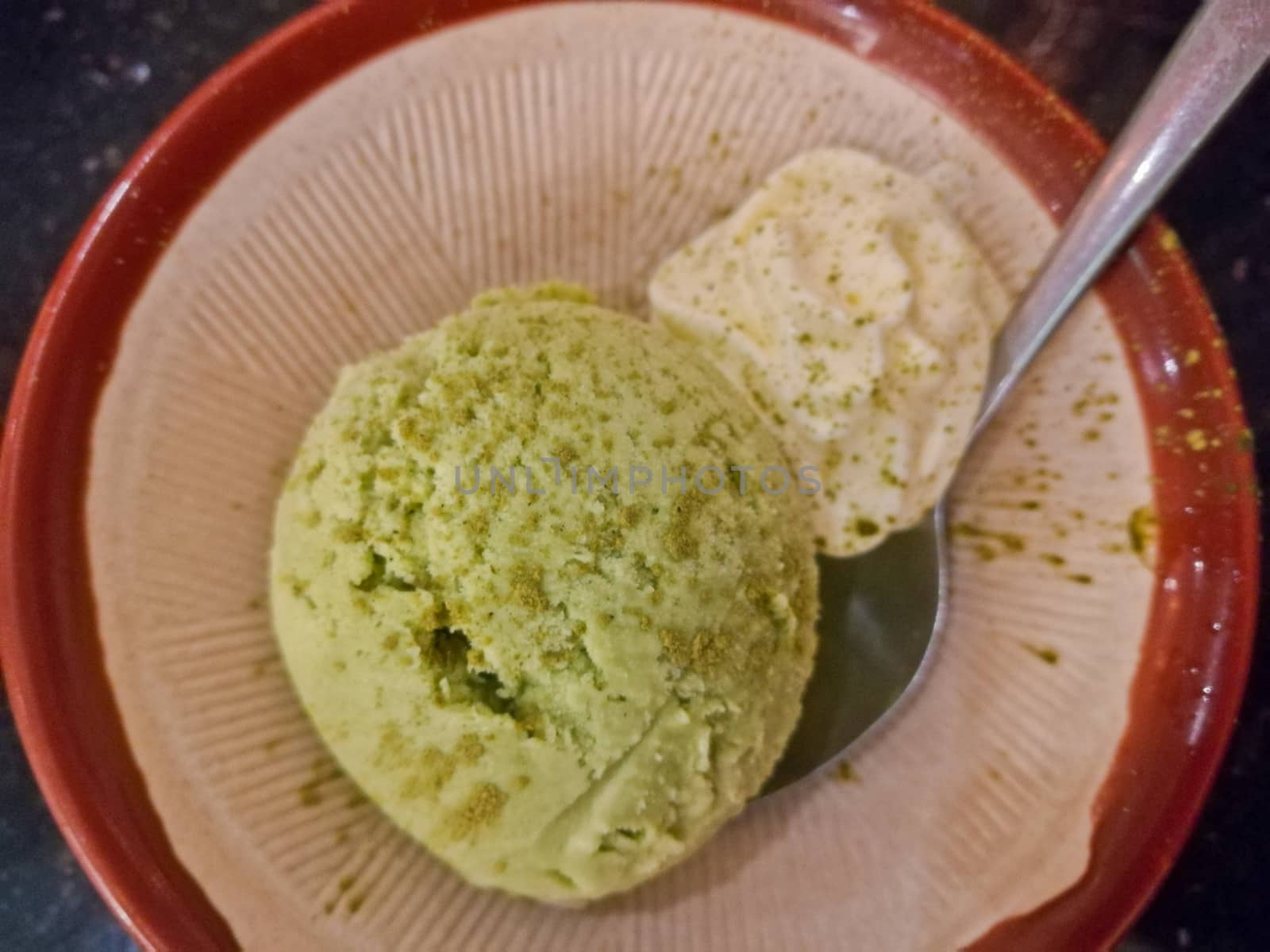 Cold sweet traditional Matcha green tea icecream top view by eyeofpaul
