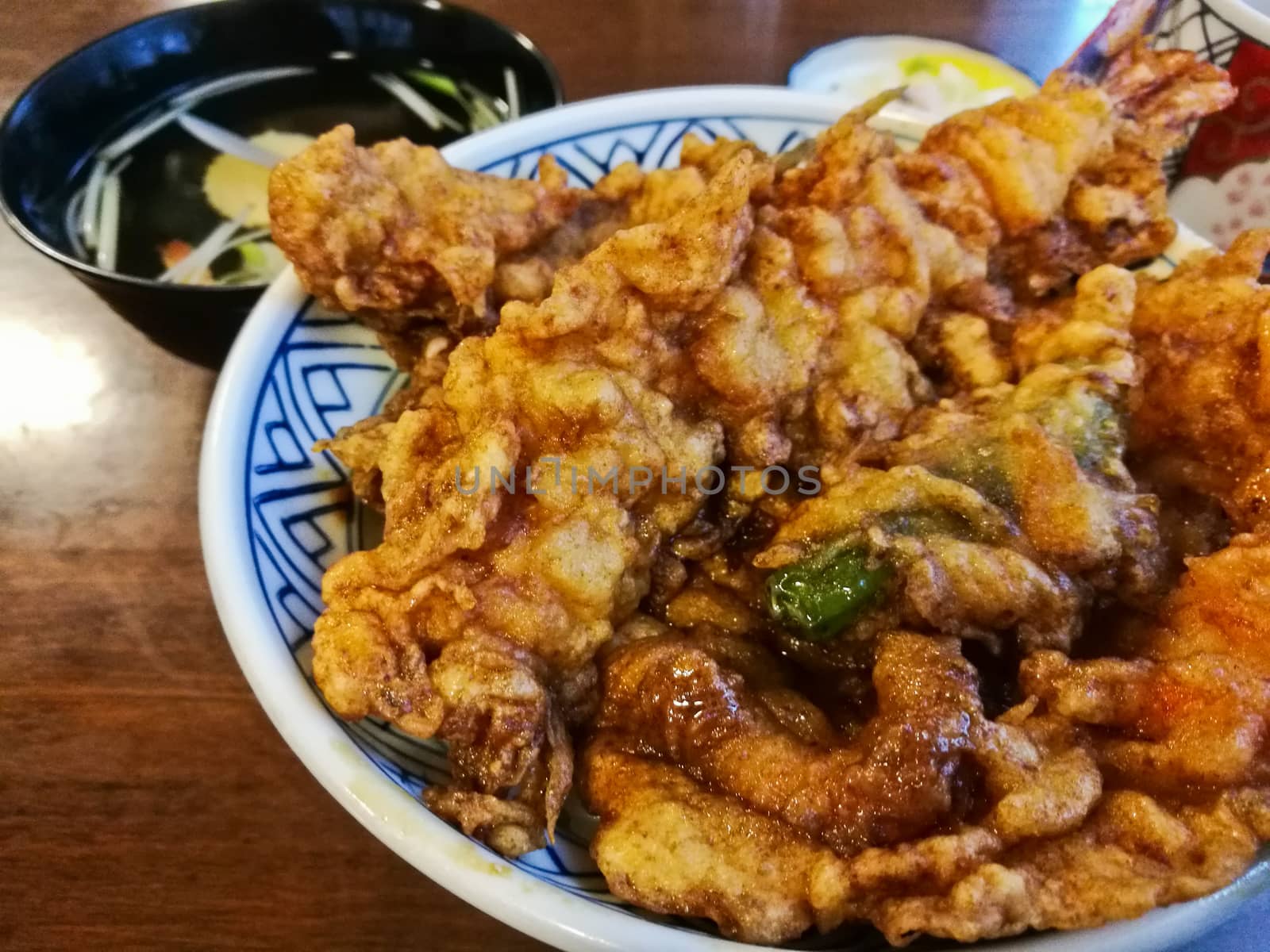 Traditional mixed prawn tempura in sesame oil on rice by eyeofpaul