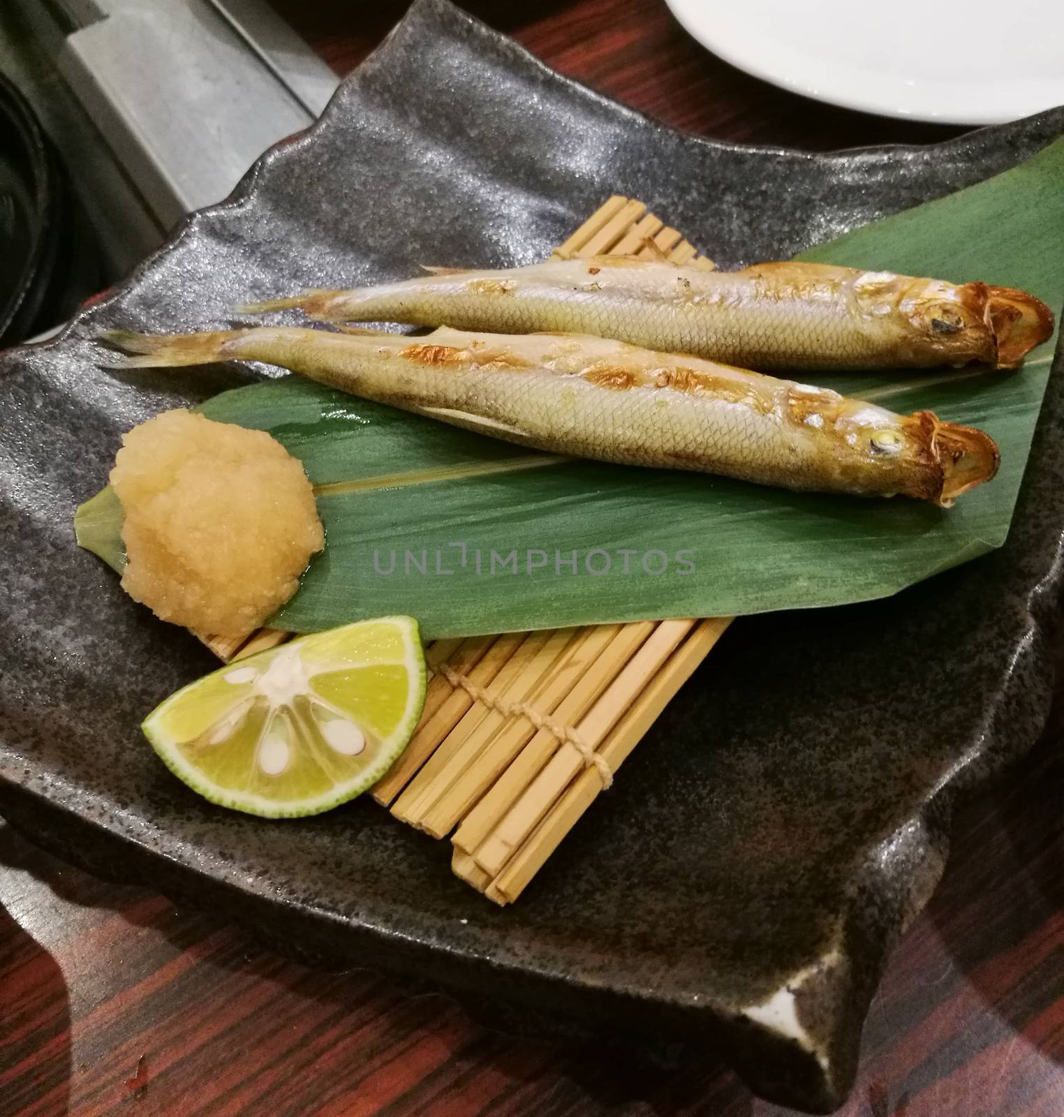 Sanma grilled Japanese egg fish served with green lime by eyeofpaul