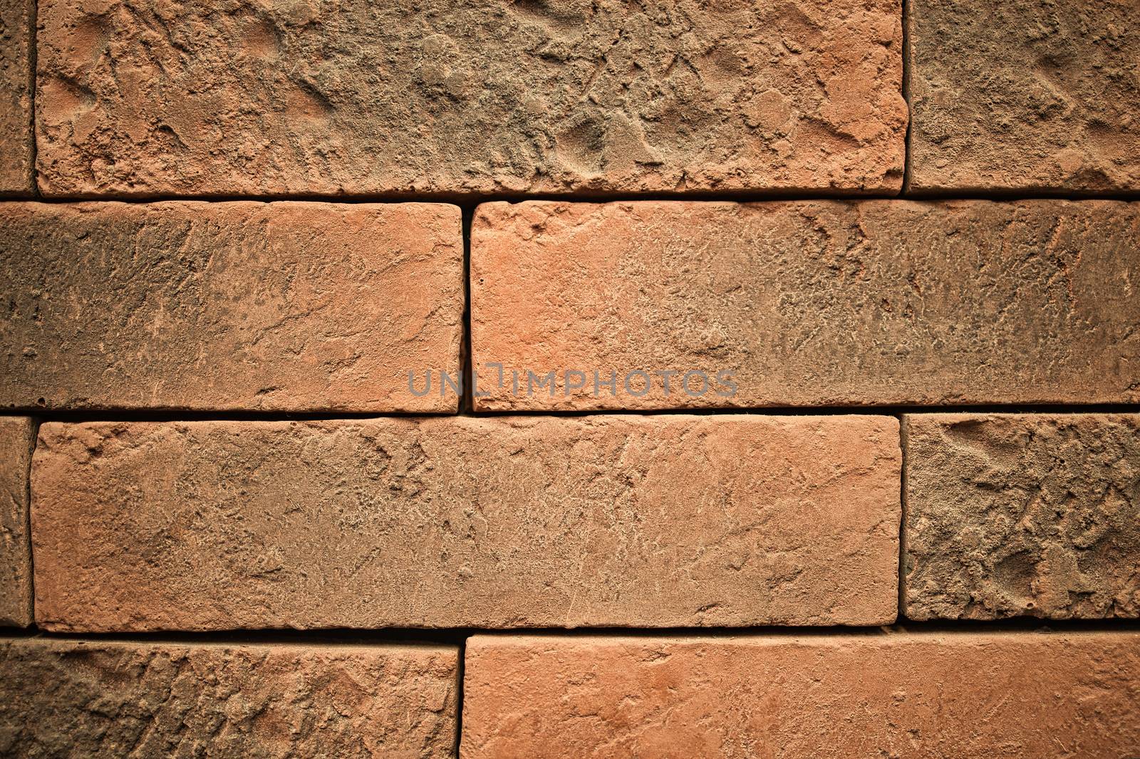 Orange brick block wall. by Nawoot