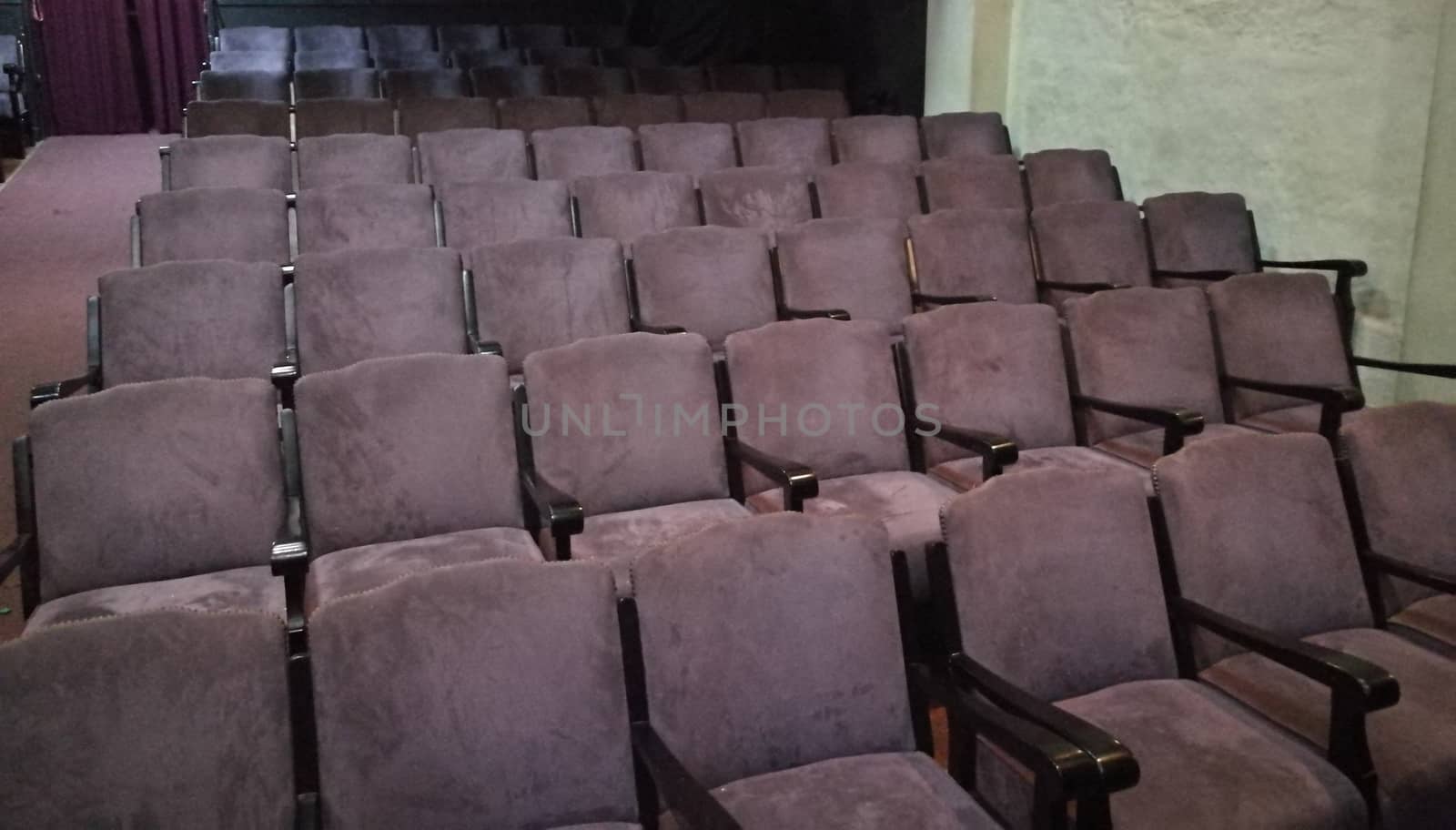 Classic purple theater seats in many rows