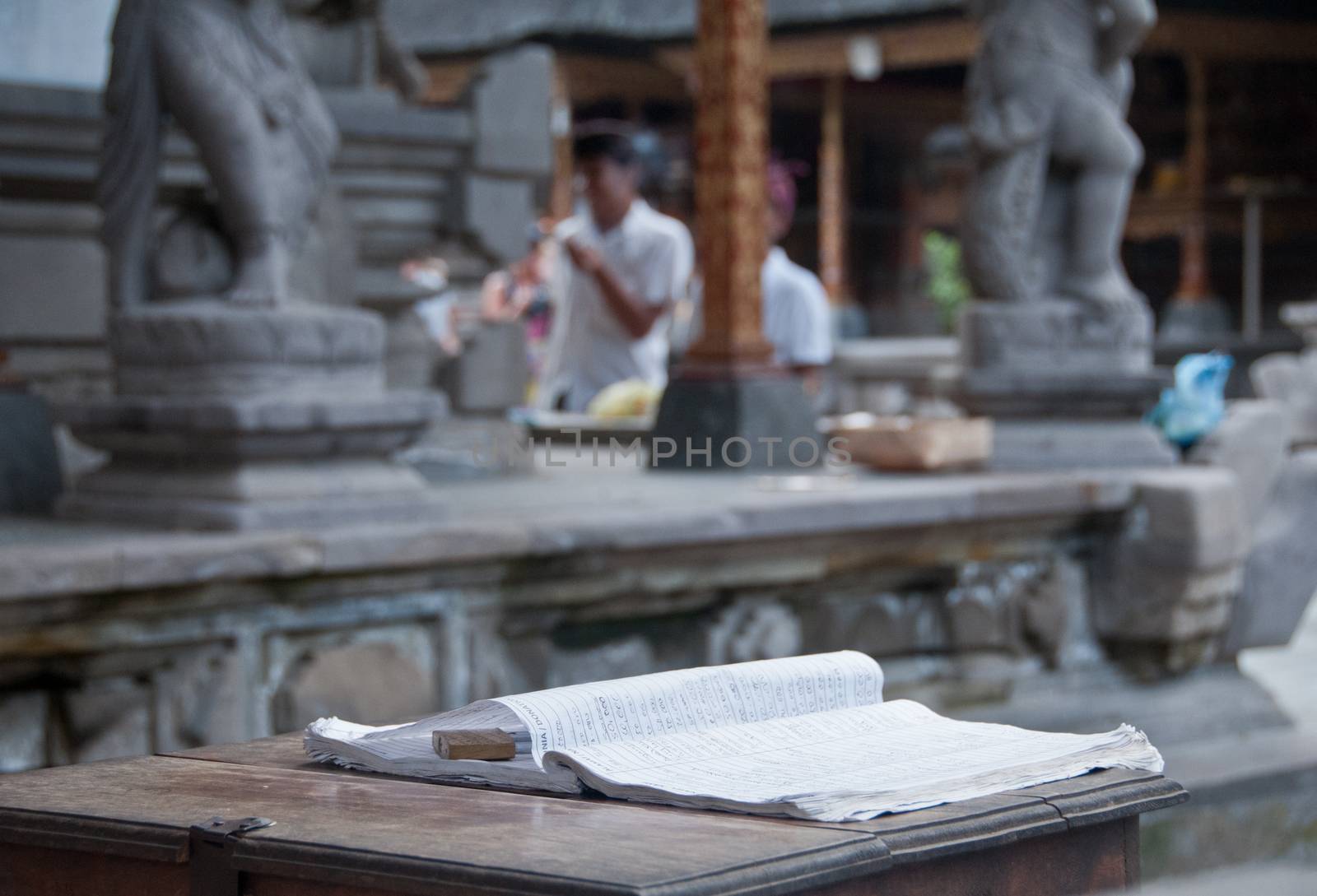 Guest book on wooden table in Bali Hindu temple