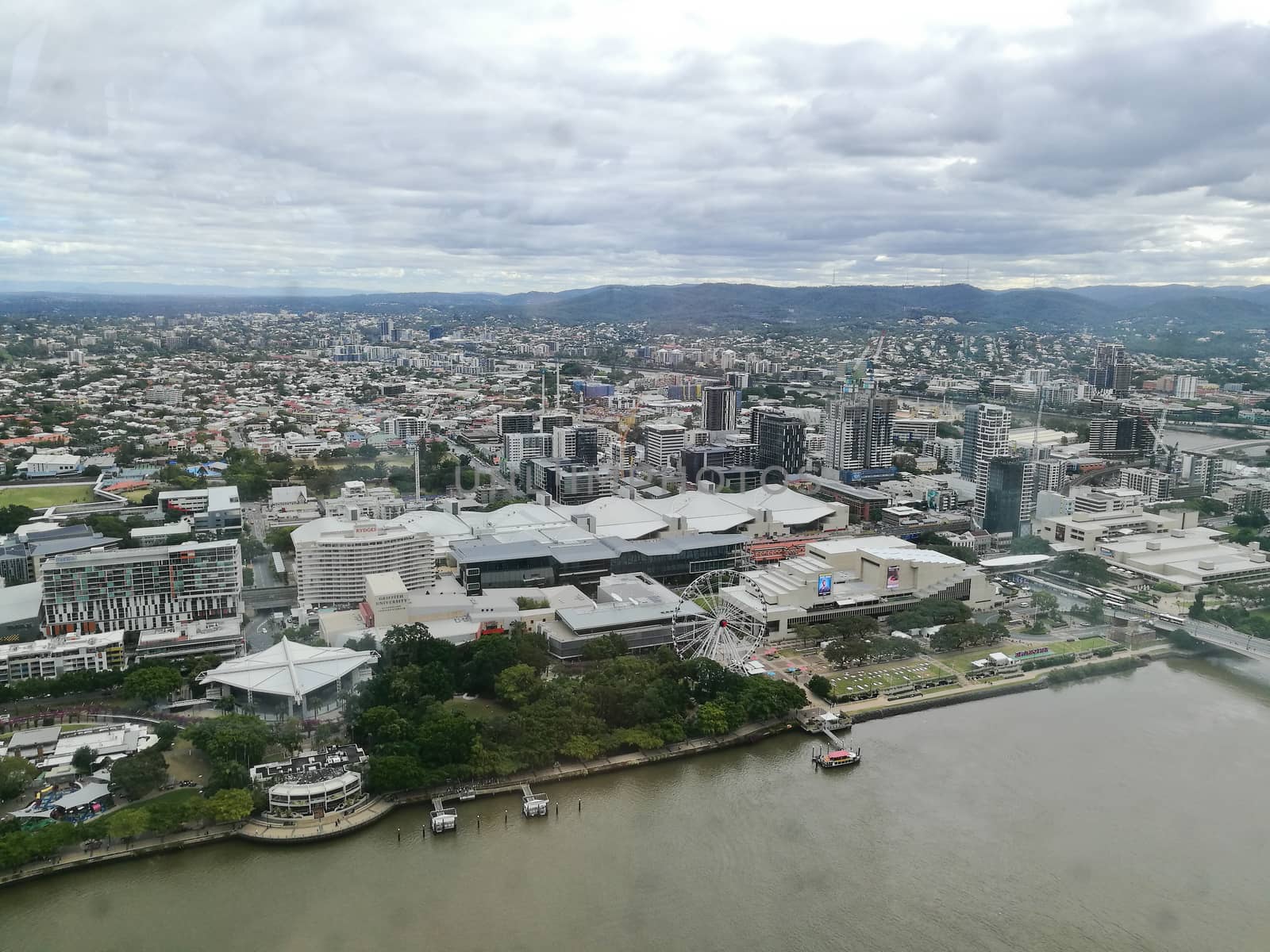 Wide bird eye view of Brisbane South bank scene in rainy afterno by eyeofpaul