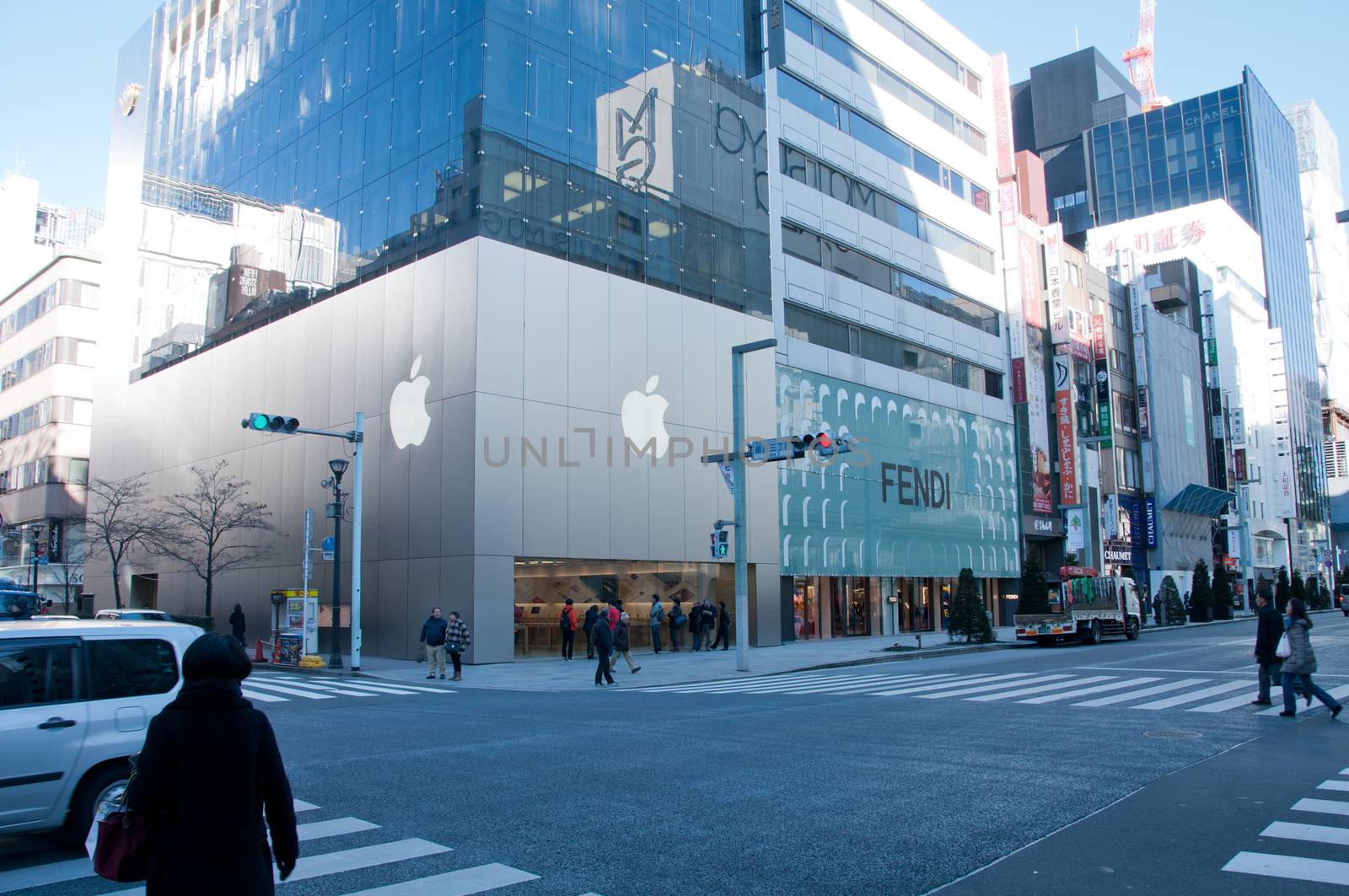 People walking in famous Apple intersection in Ginza Tokyo Japan by eyeofpaul