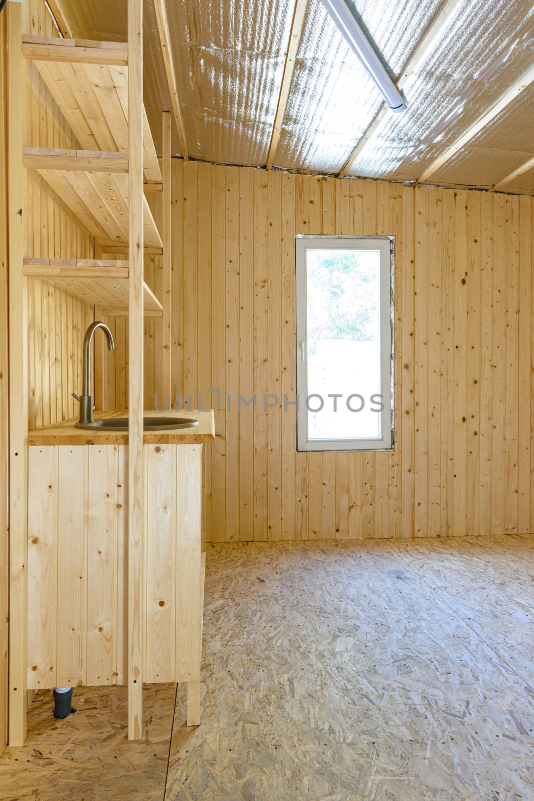 Installed stylish author's homemade kitchen in the interior of a small country house