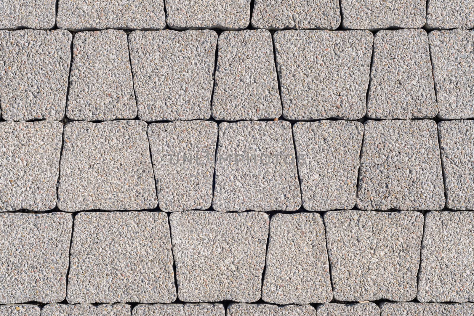Background - gray paving stones of trapezoidal shape