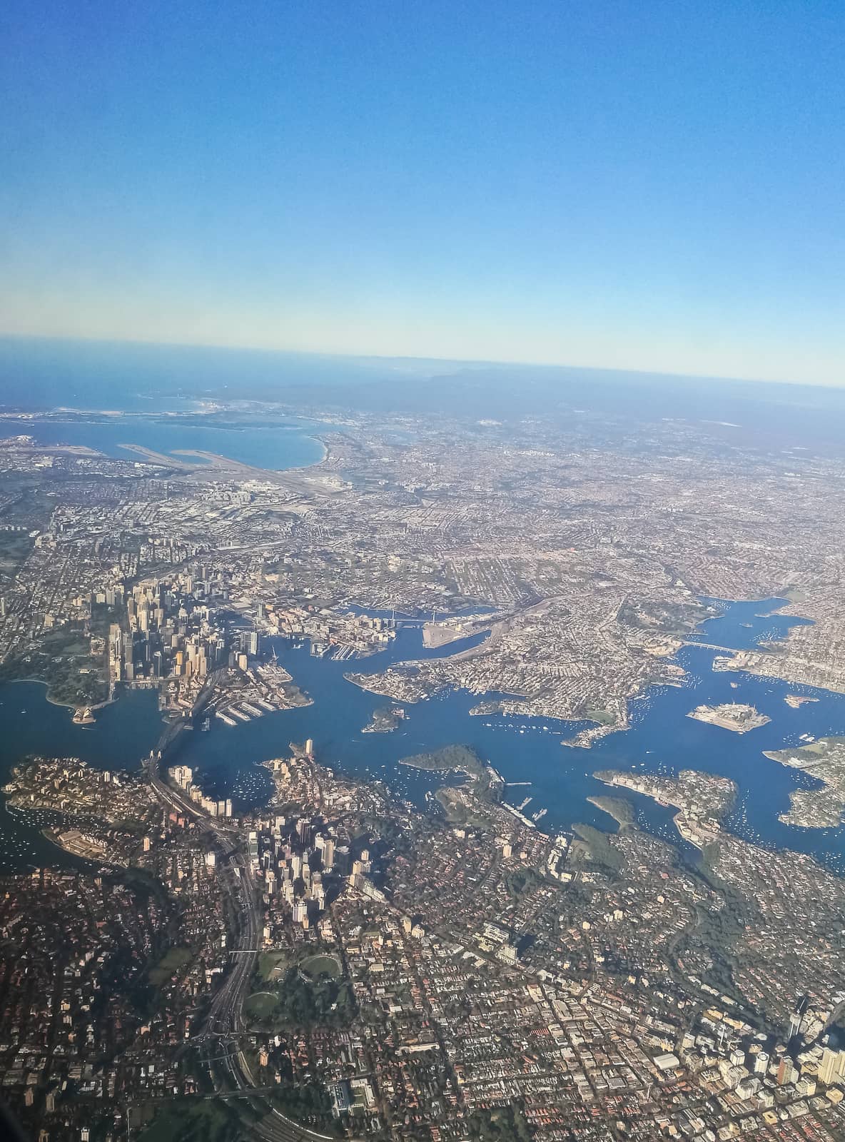 Bird eye view aerial scene of Sydney Australia city center from an airplane window