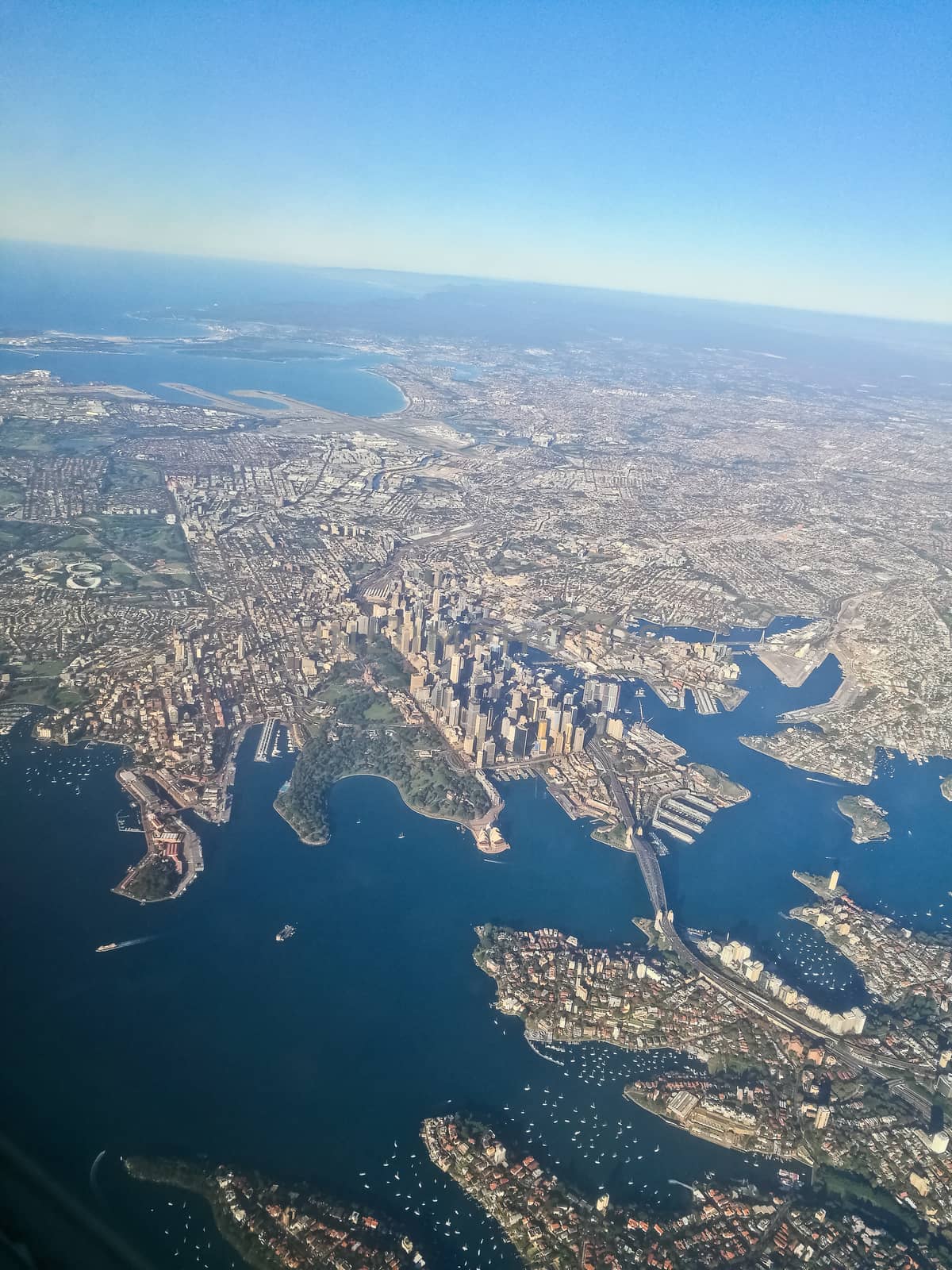 Bird eye view aerial scene of Sydney Australia city center from an airplane window