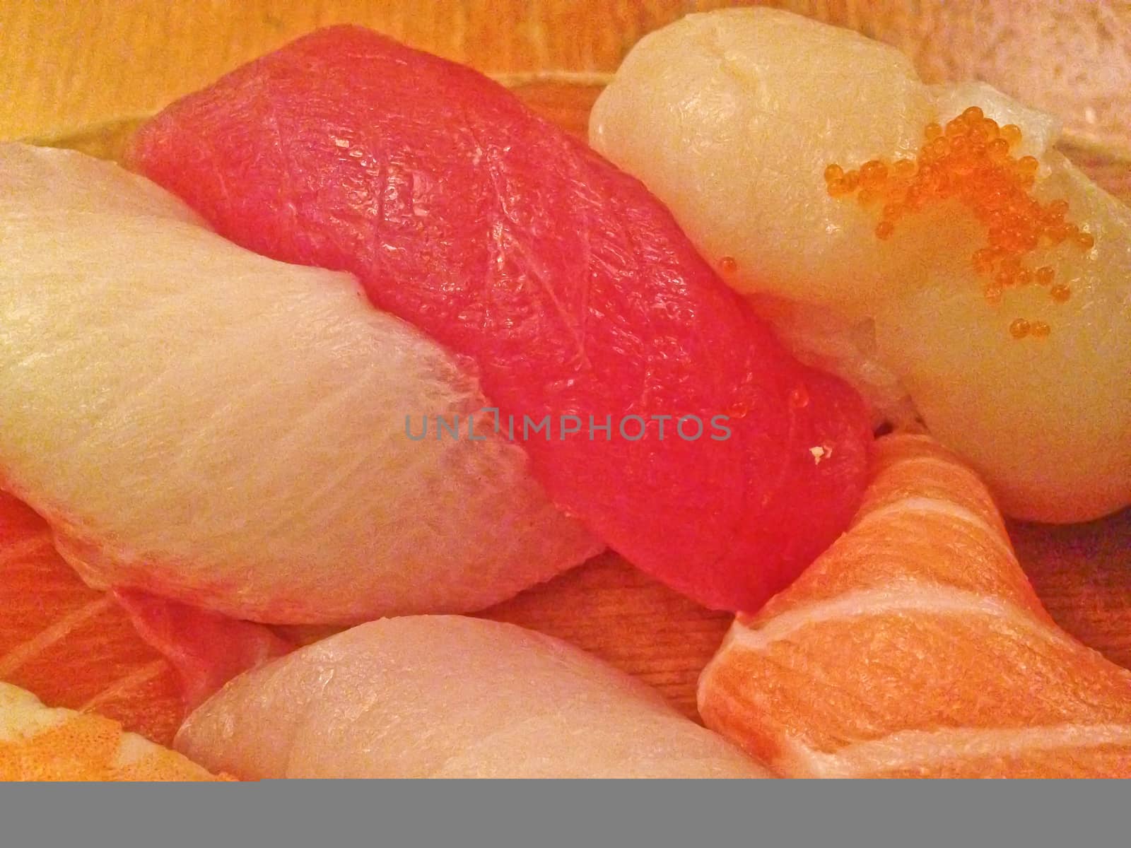 Mixed fresh Japanese sushi platter served on wooden plate by eyeofpaul