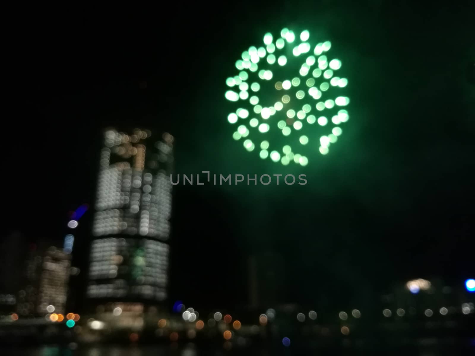 Defocused abstract scene of riverside firework in city center at by eyeofpaul