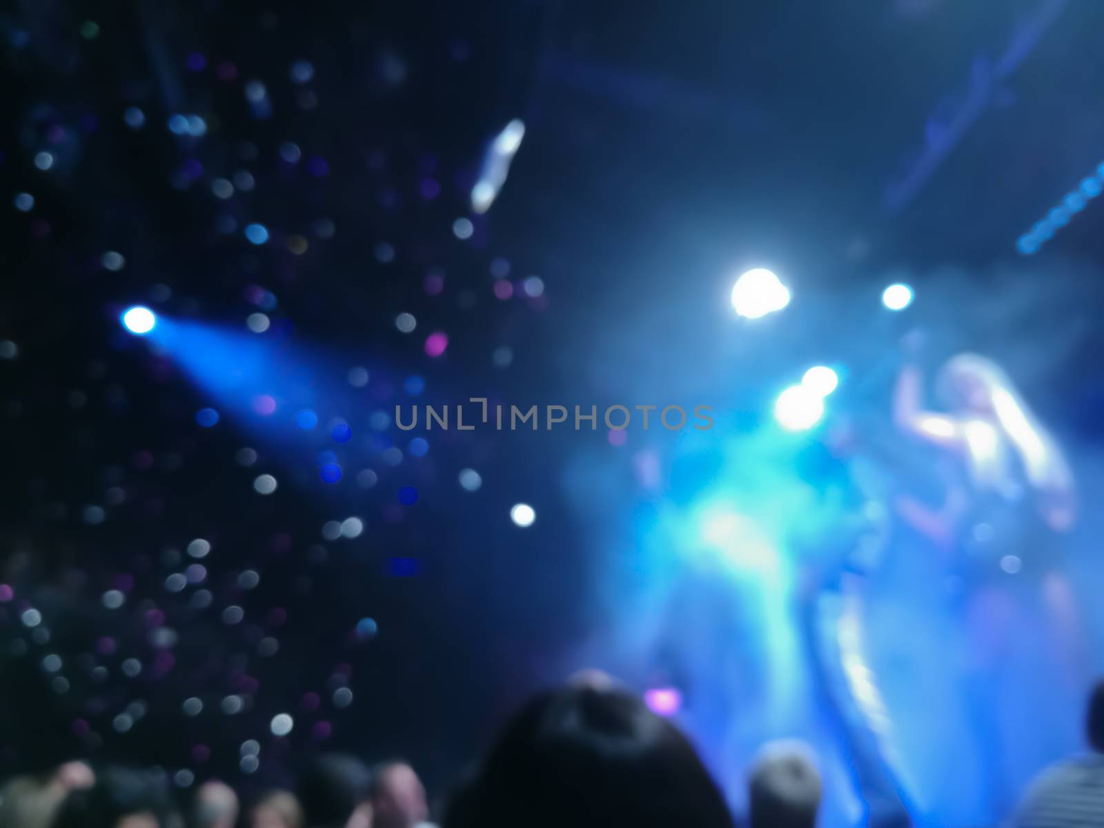 Defocused abstract blurred scene of musical light performance in by eyeofpaul