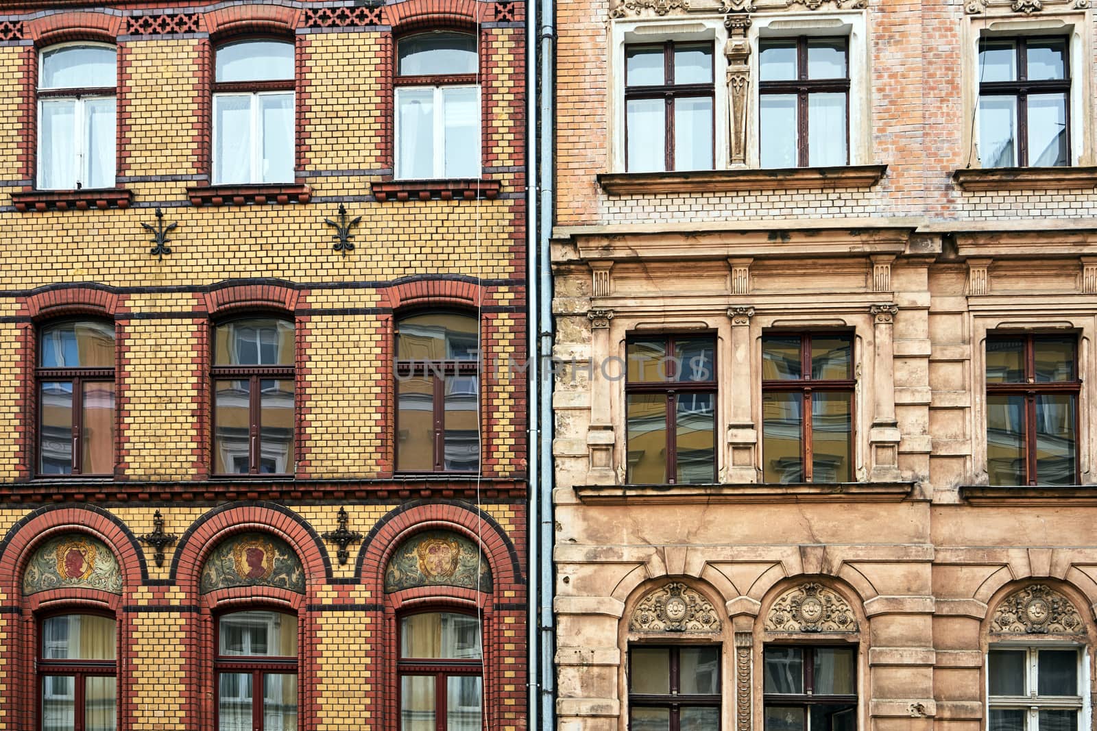 fragment of the facade of historic tenement houses in Poznan