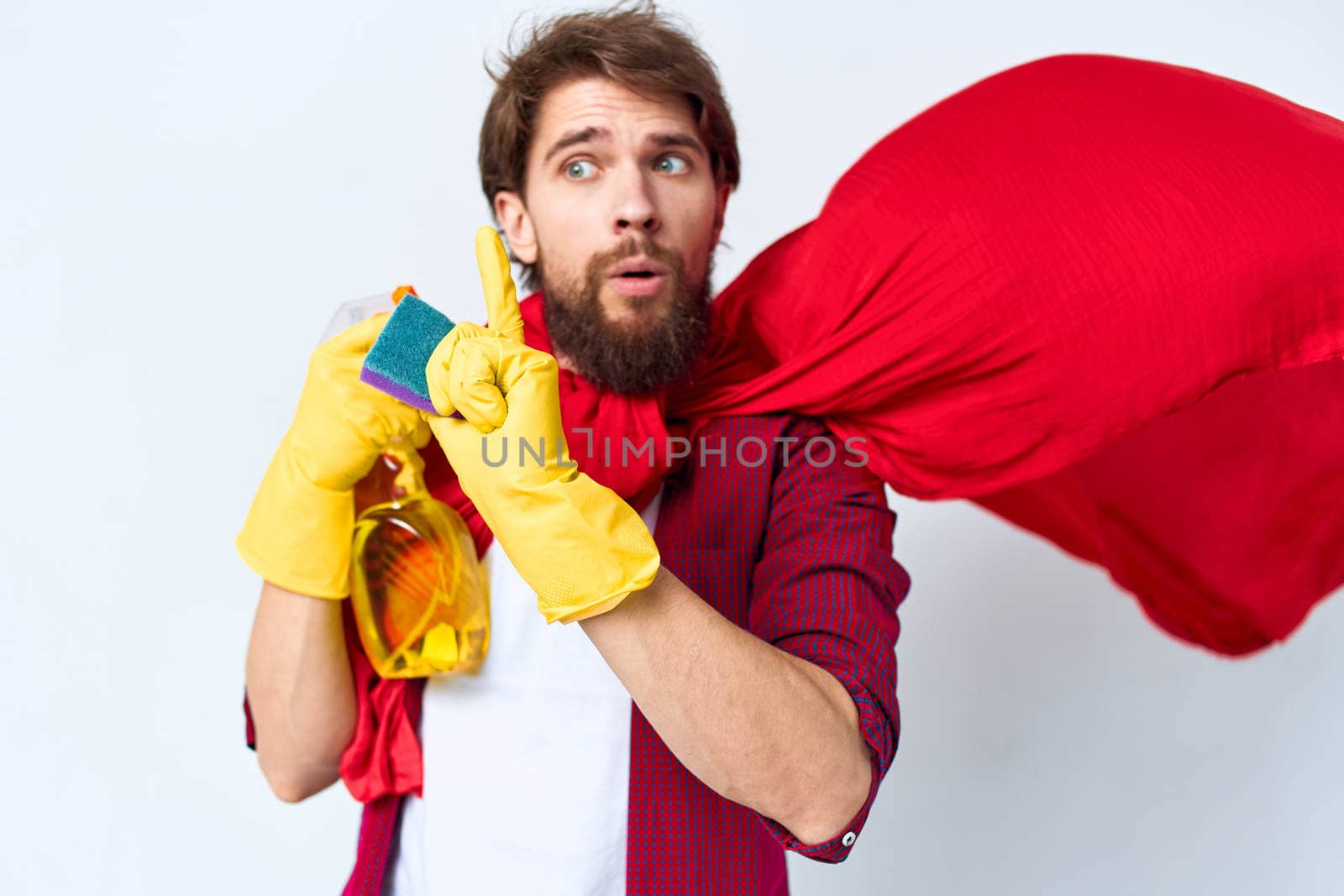 Man in red raincoat detergent professional work lifestyle. High quality photo