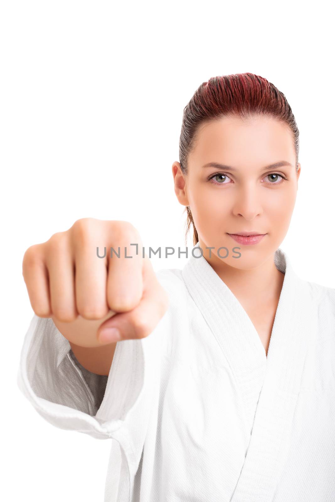 Girl in white martial arts kimono punching the camera by Mendelex