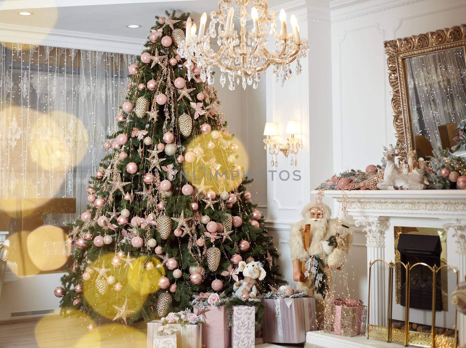 Christmas tree standing living room interior near fireplace gift box lie on carpet near evergreen fir Christmas time. Norning holidays