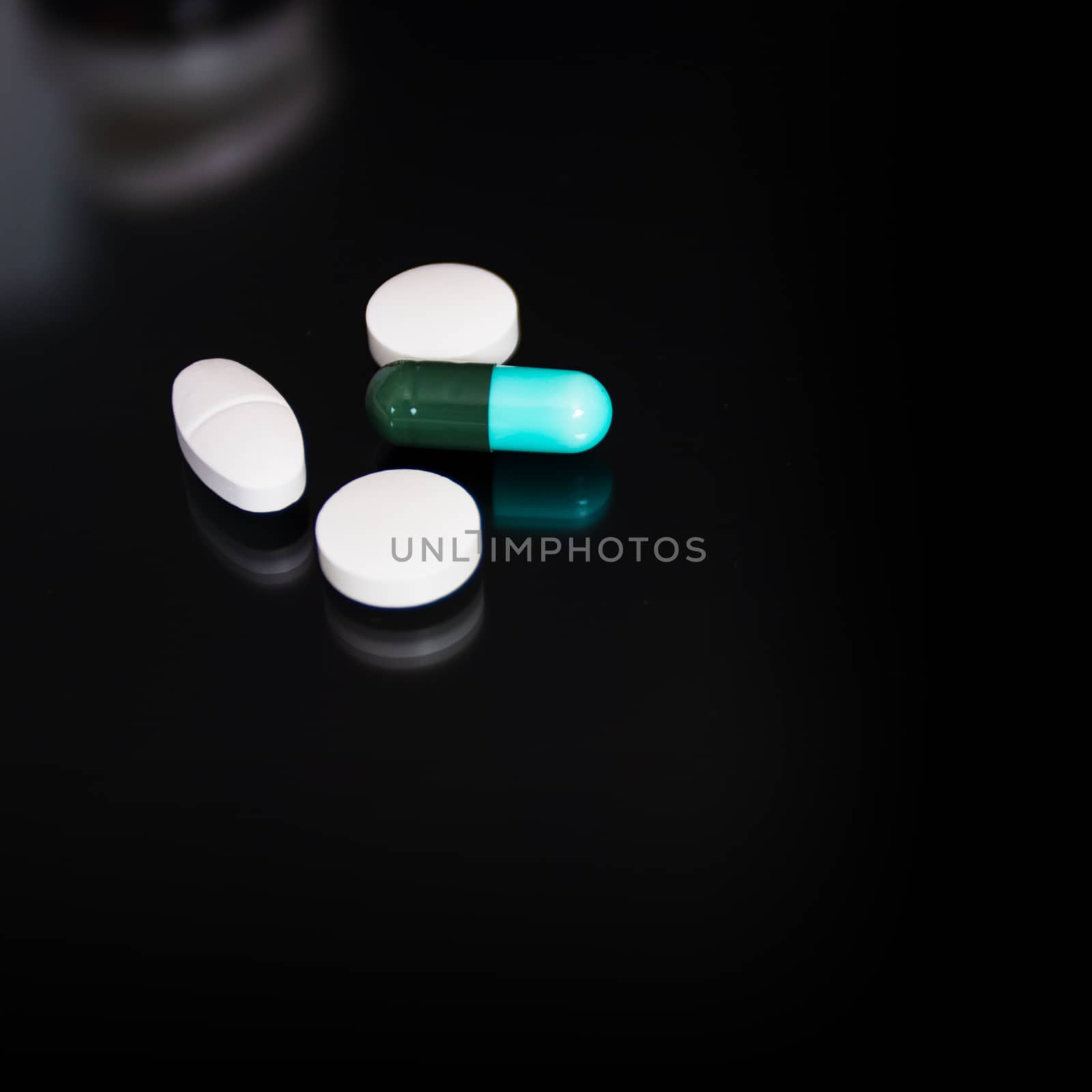 Medical concept, Drug capsule for treatment on black background.