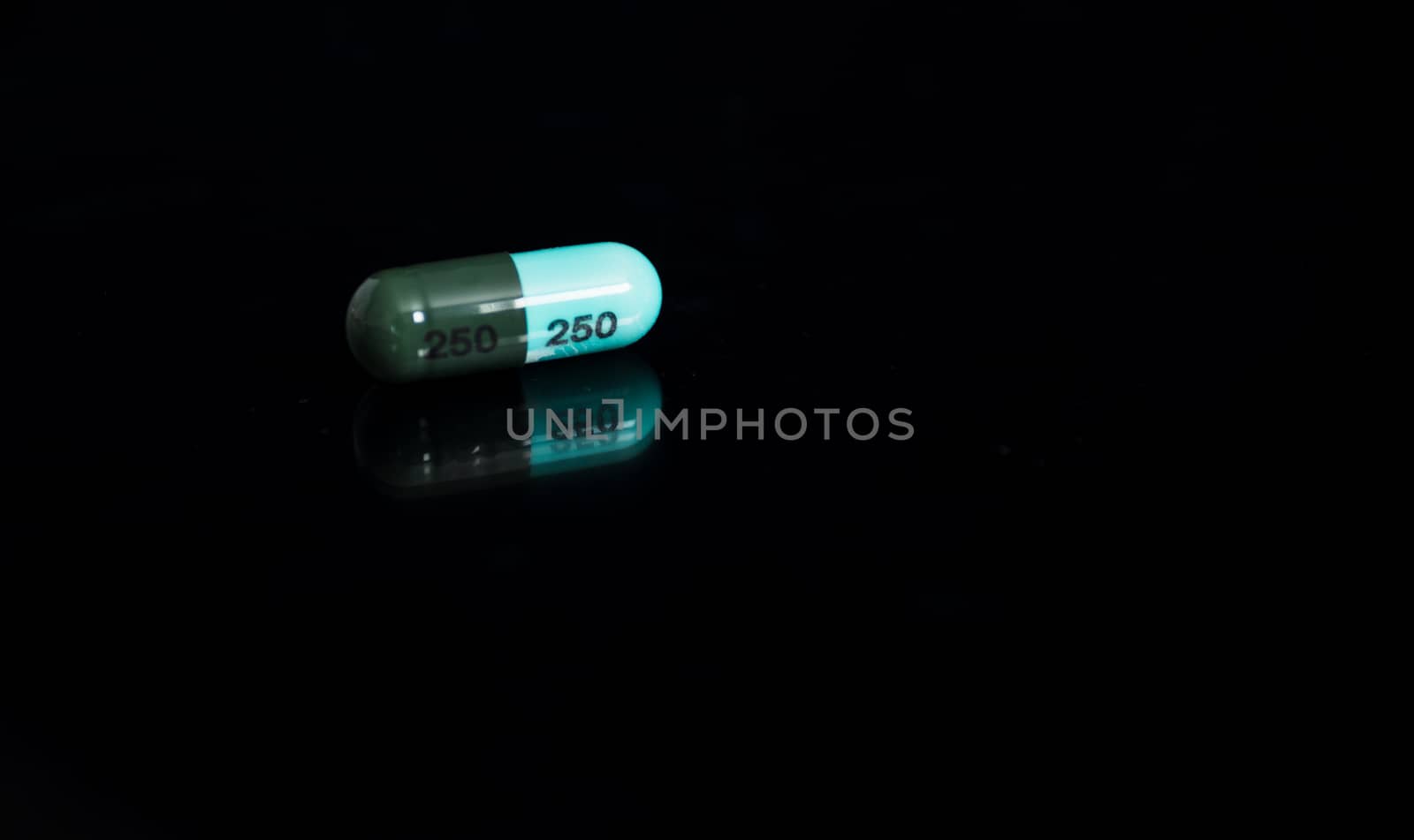 Medical concept, Drug capsule for treatment on black background.