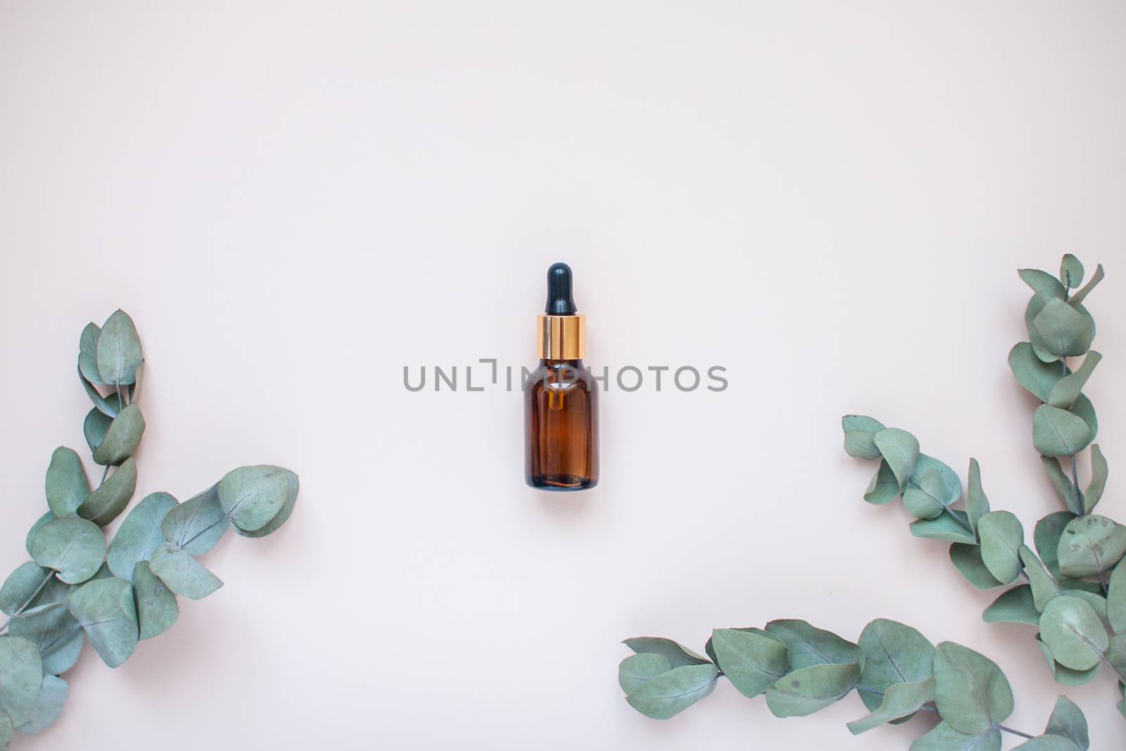 Bottles with face serum on a light background. Beauty industry. Layout