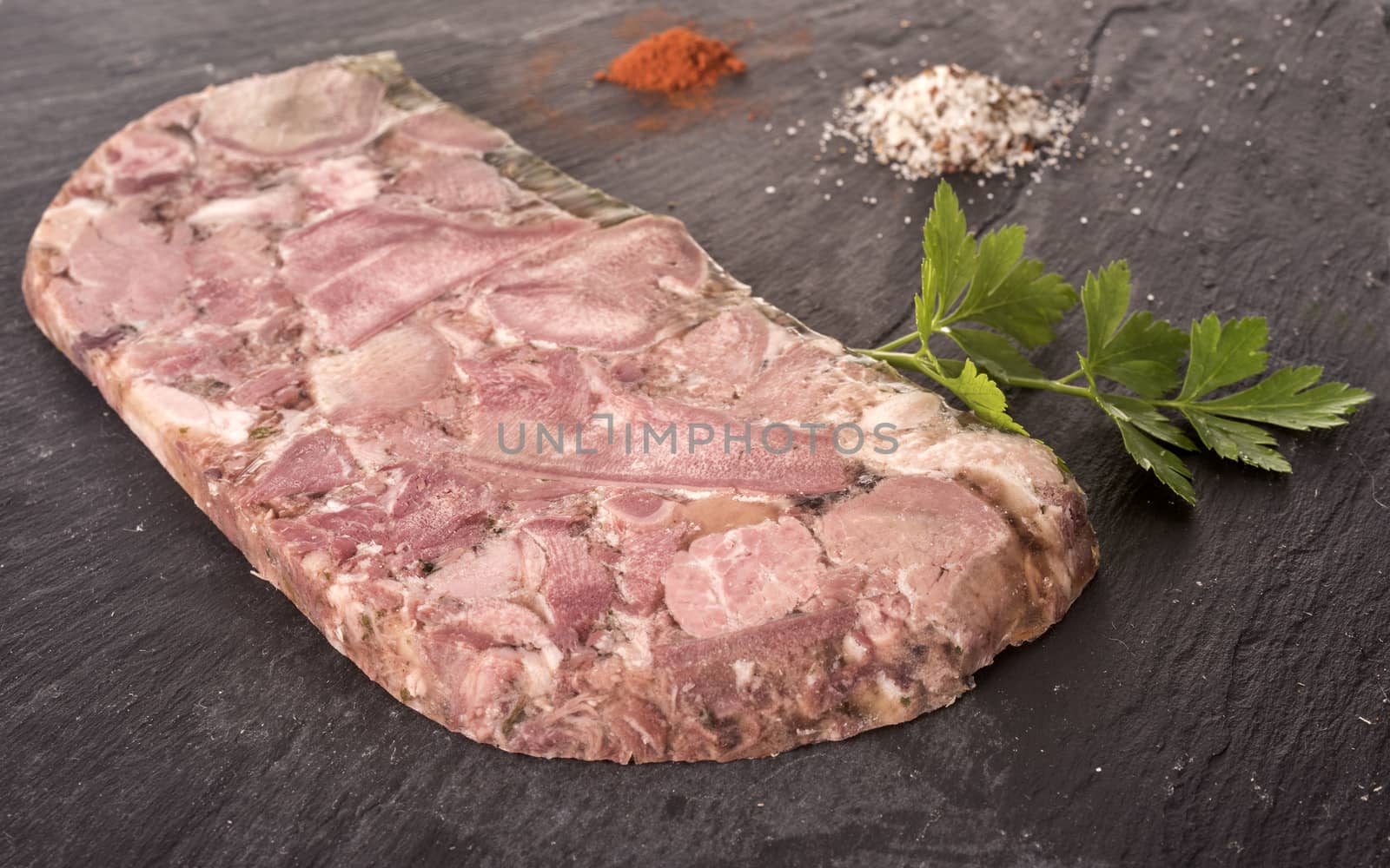 head cheese in front of white background 