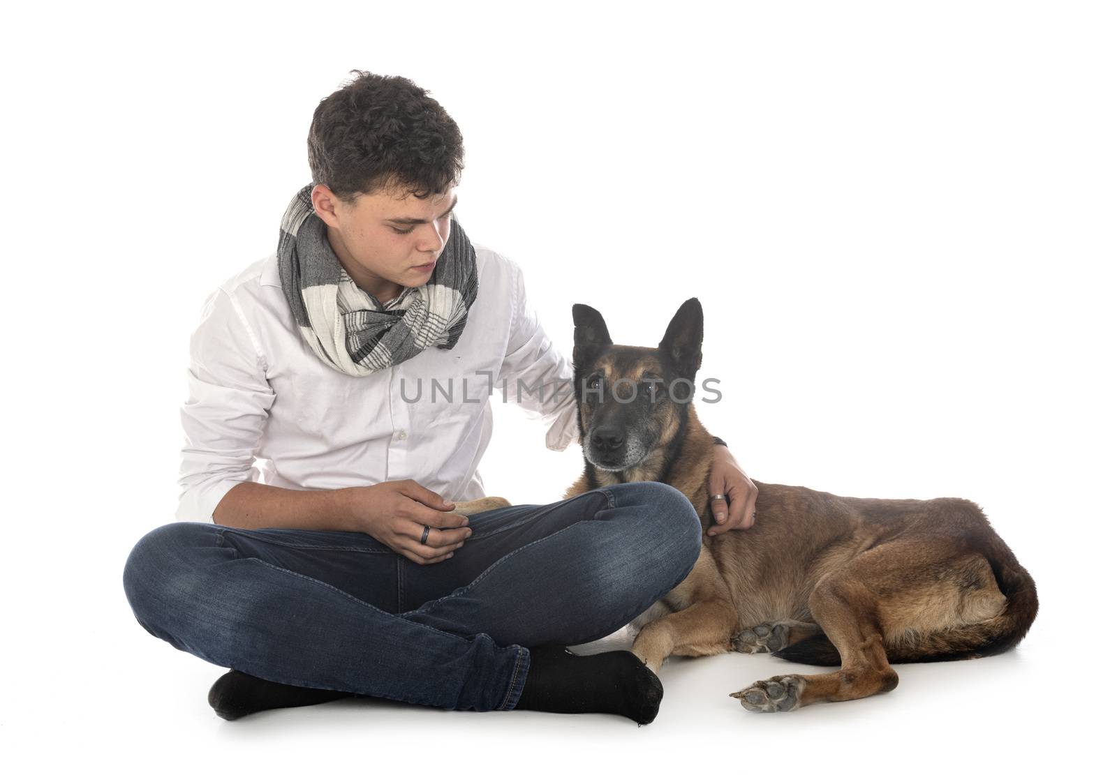 old belgian shepherd and owner in front of white background