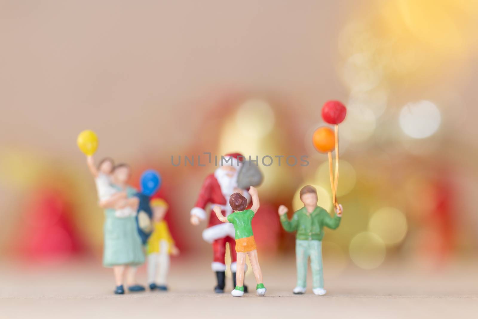 Miniature people, Happy family celebrating A Christmas by sirichaiyaymicro