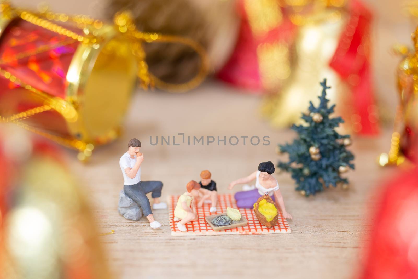 Miniature people, Happy family celebrating A Christmas by sirichaiyaymicro