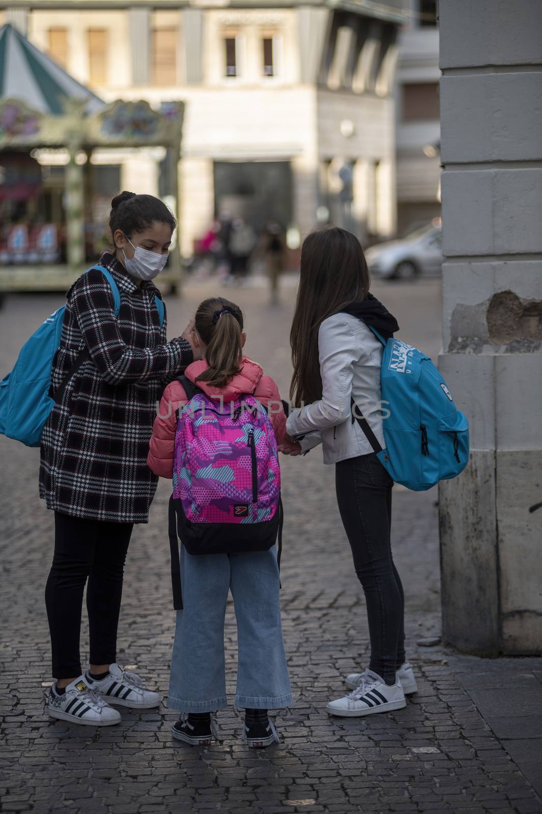 terni,italy october 26 2020:children who go to school with backpack and medical mask cause covid 19