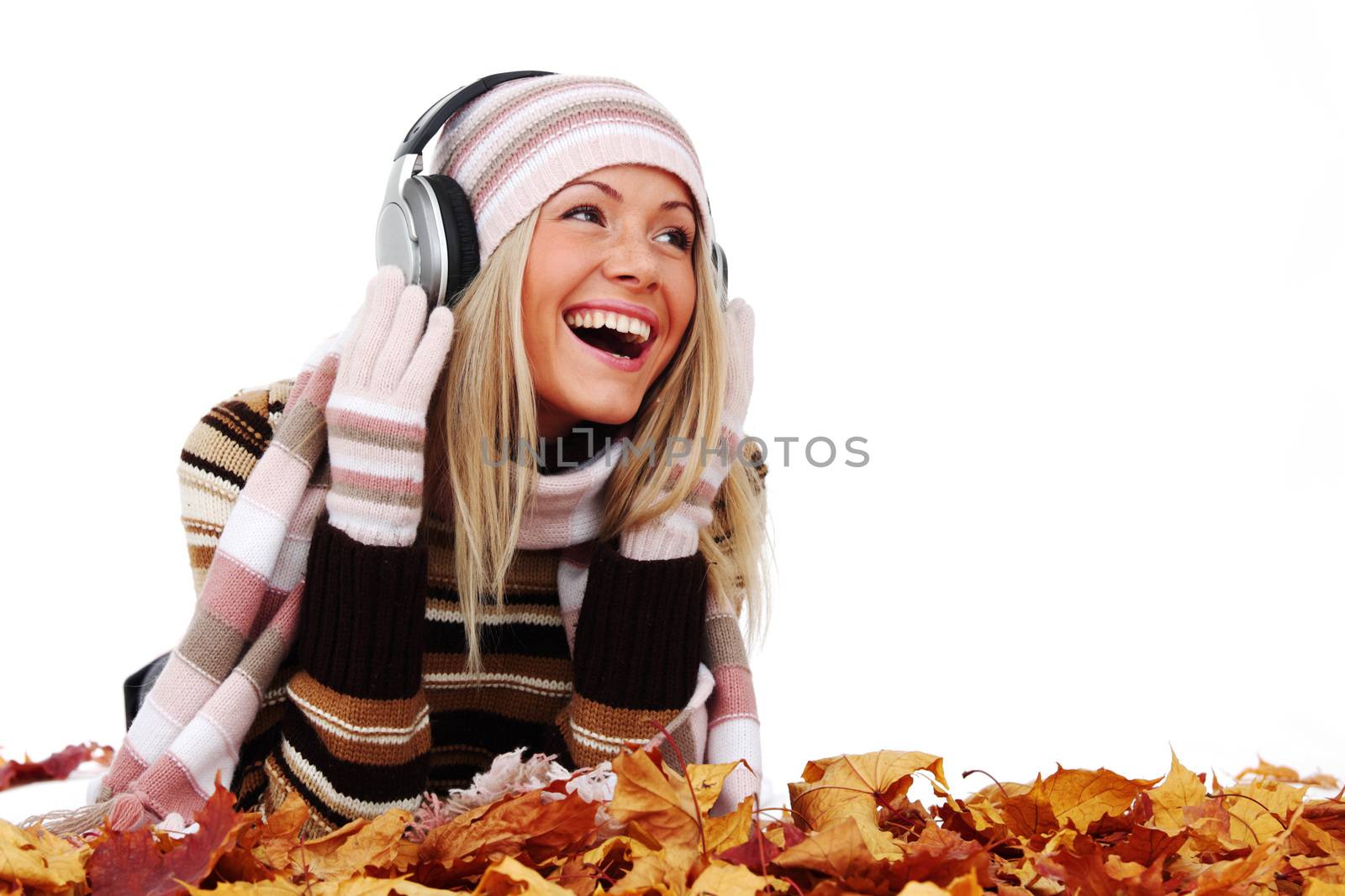 autumn woman listening music in studio isolated on white background