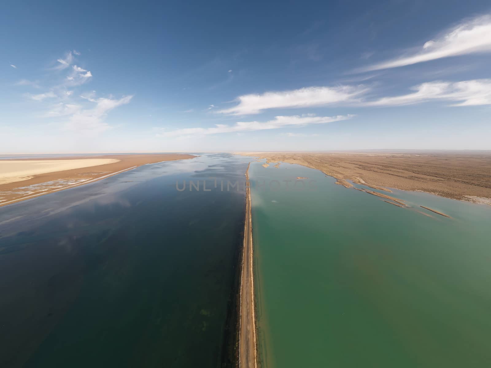 The lake with a path in the middle. Photo in Qinghai, China.