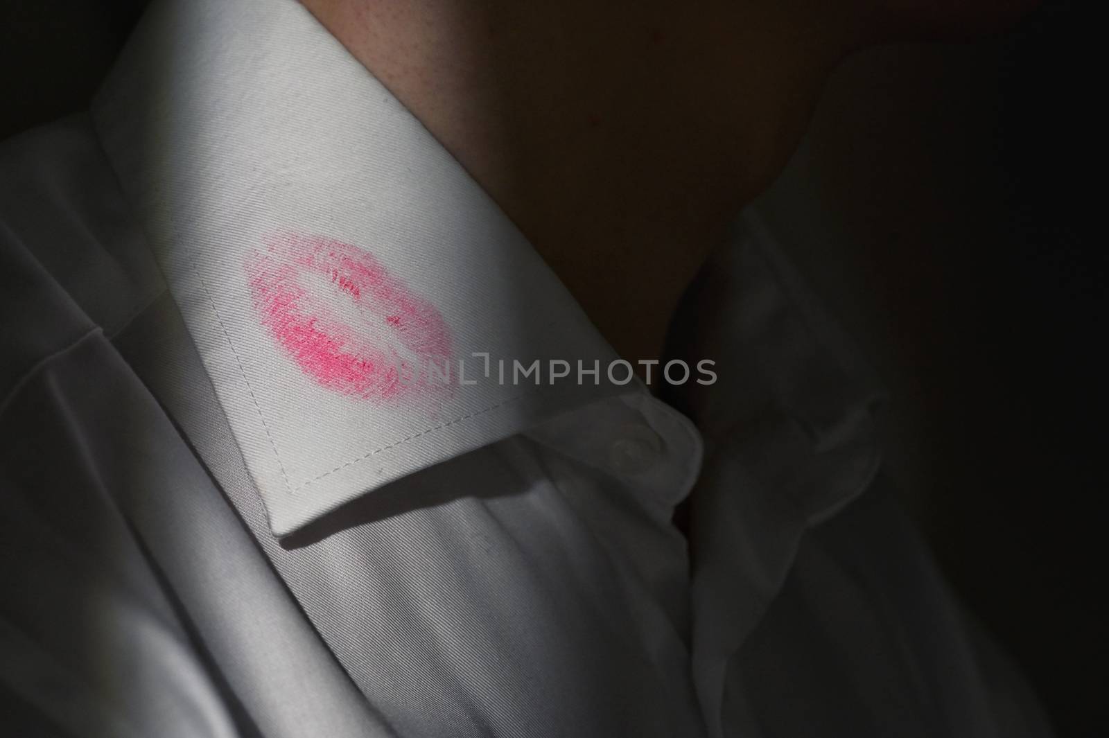Lipstick marks on the collar of a men's white shirt by mady70