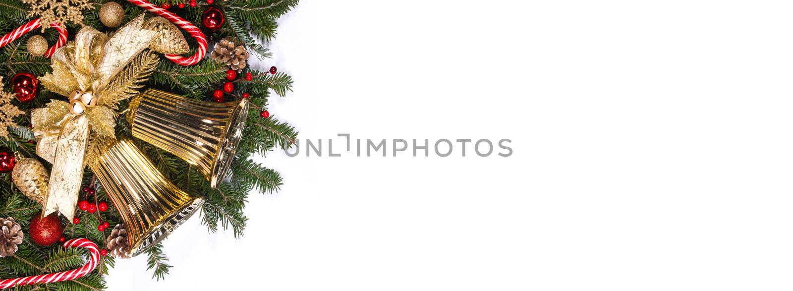 New Year and Christmas composition design isolated on white background, fir tree branches jingle bells golden and red decorative baubles and pine cones traditional design