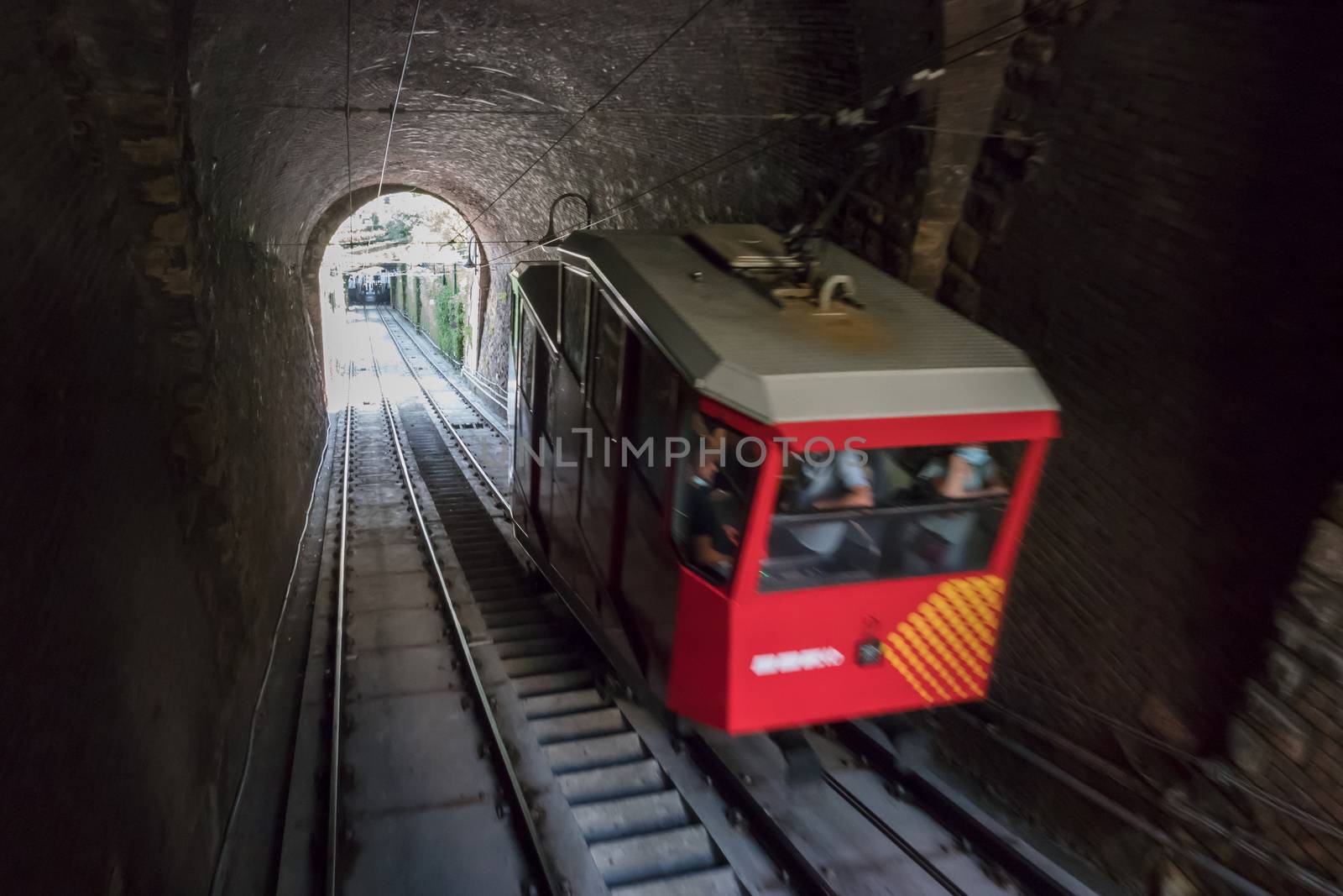 Upper city funicular line in Bergamo (Funicolare Citta Alta). Red funicular connects old Upper City and new. Bergamo (upper town), ITALY - August 19, 2020.