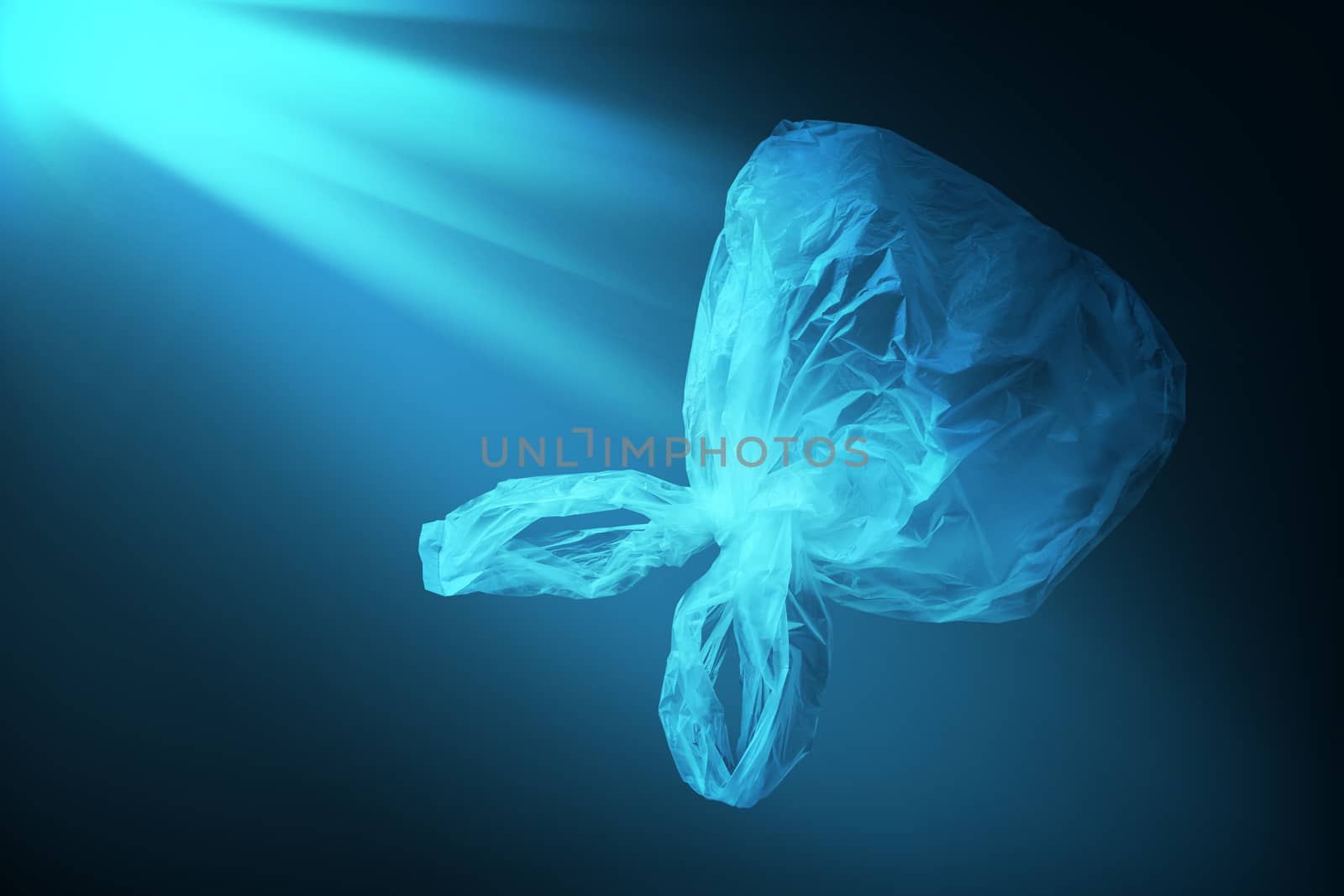 creative background of single-use transparent plastic bags in form of jellyfish floating in sea or ocean with sunlight effect, concept of environmental pollution